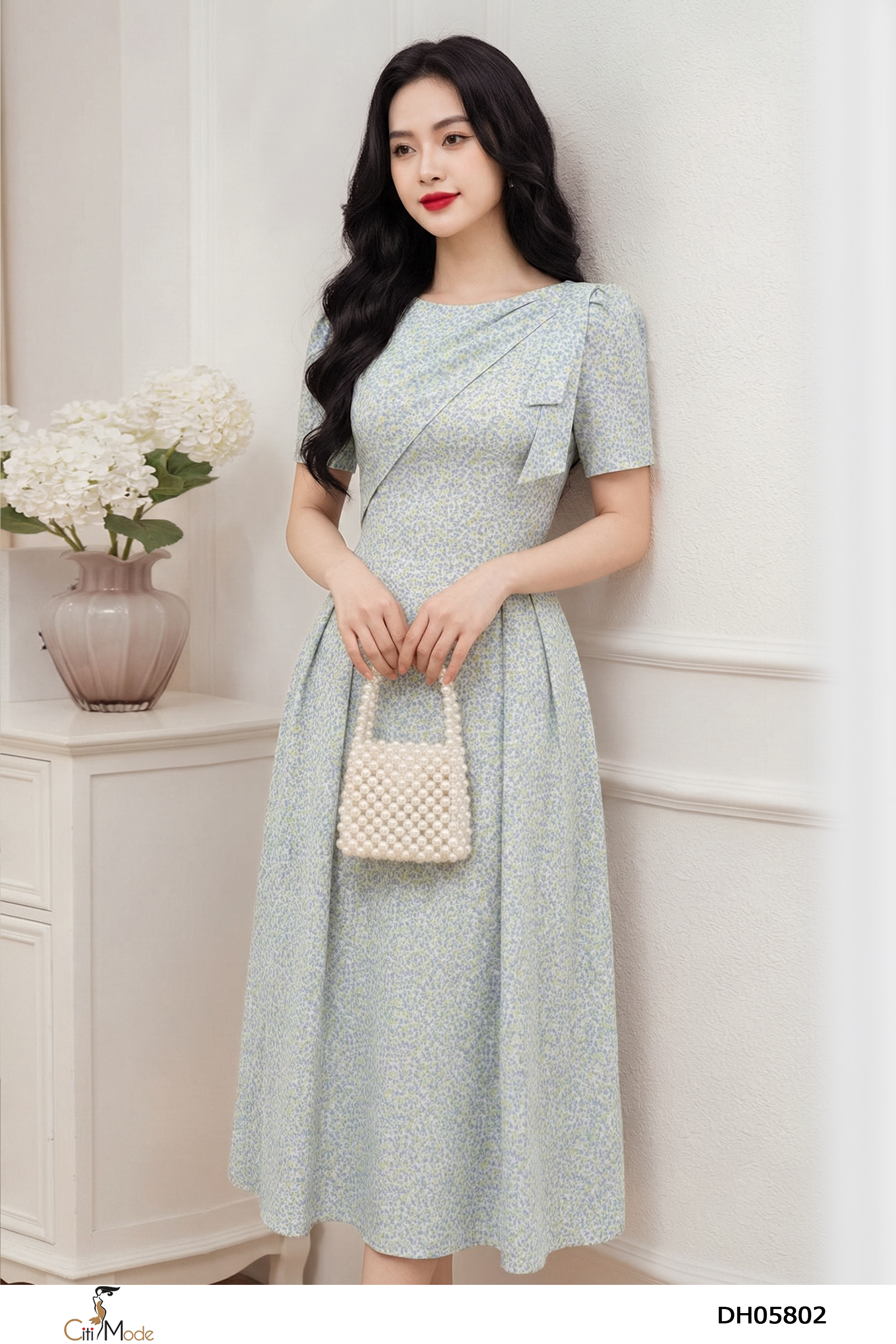 Đầm xòe hoa nhí xanh nhạt cổ vạt nơ vai cách điệu