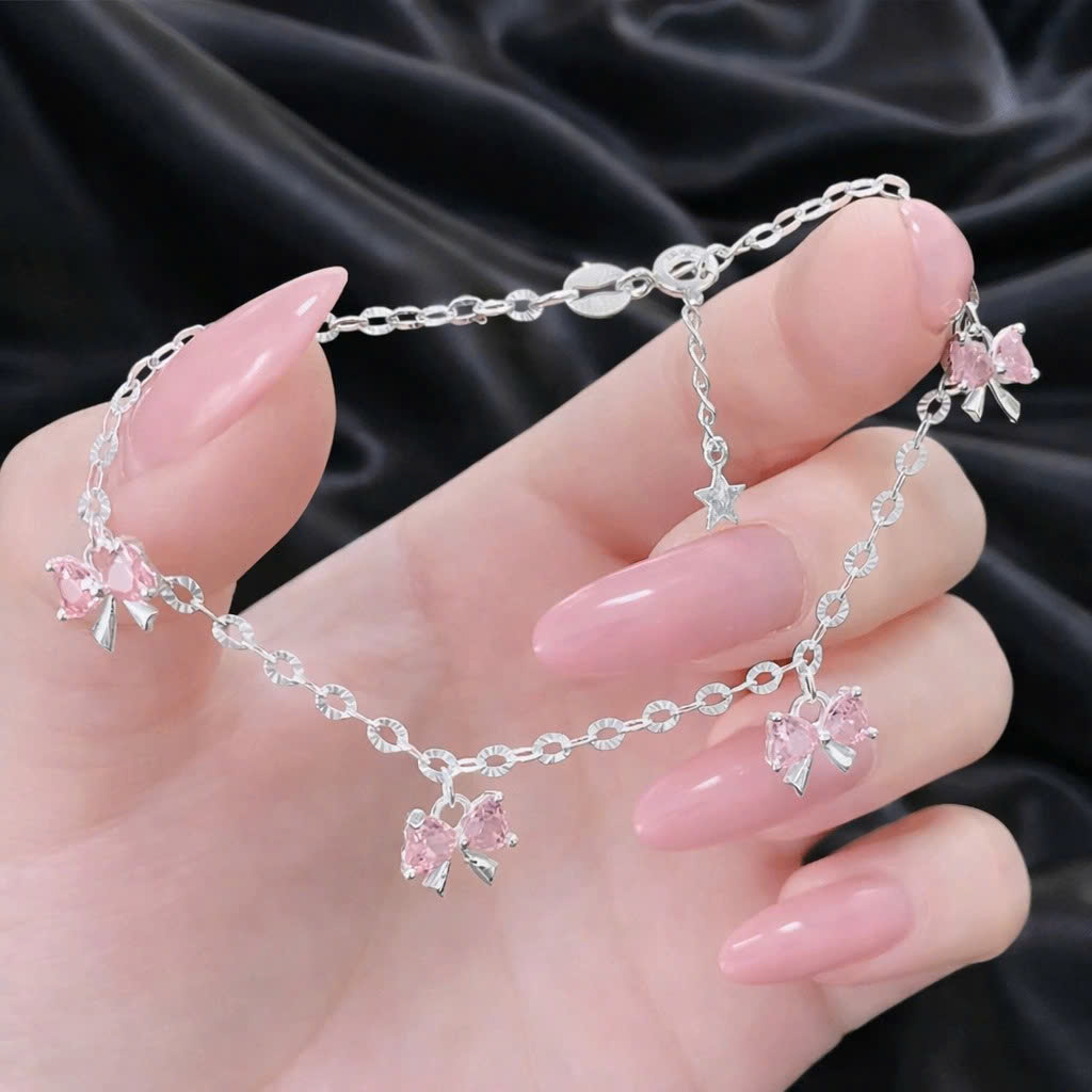 Vòng tay bạc xi kim nơ tim hồng