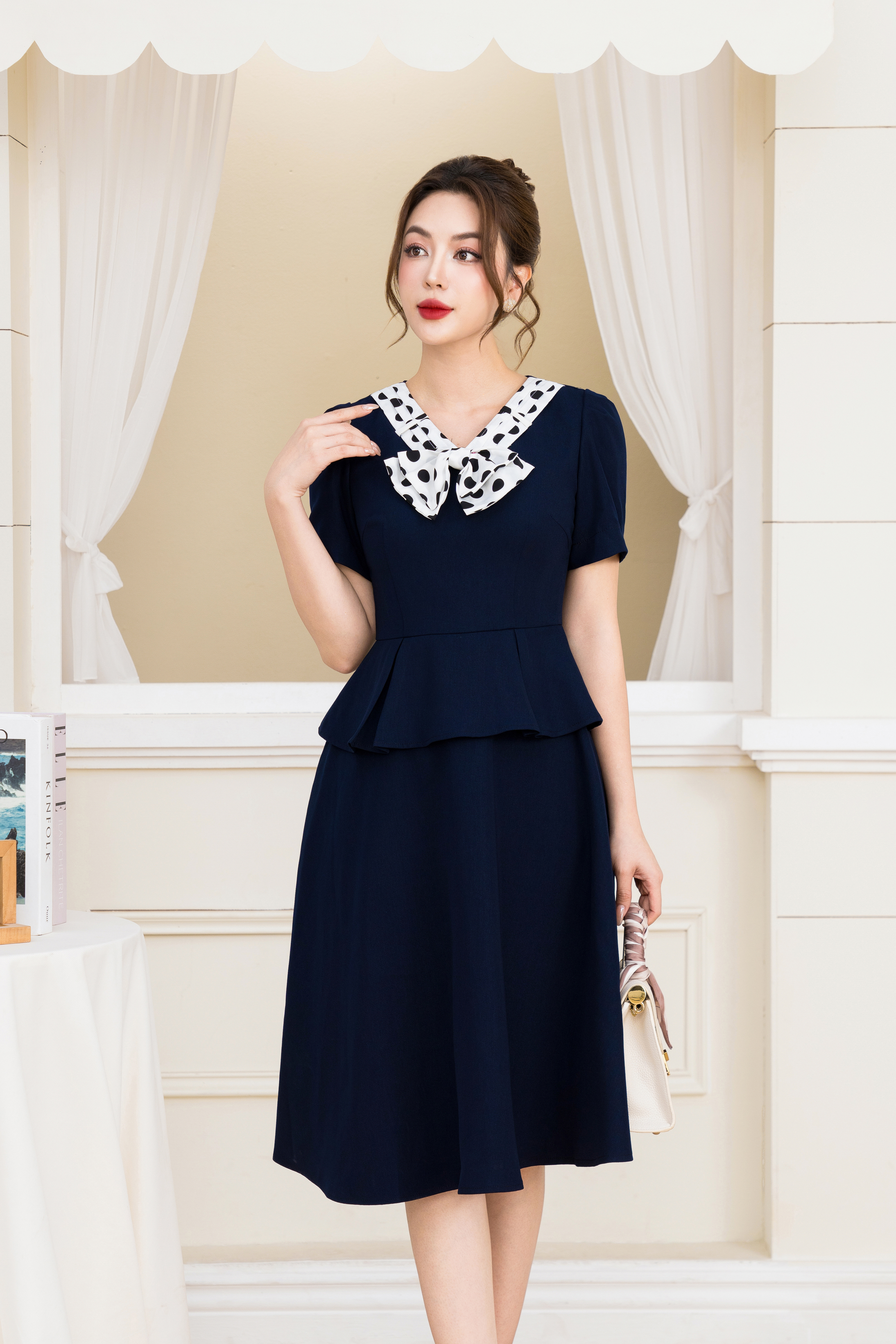 Đầm xoè peplum phối cổ nơ chấm bi