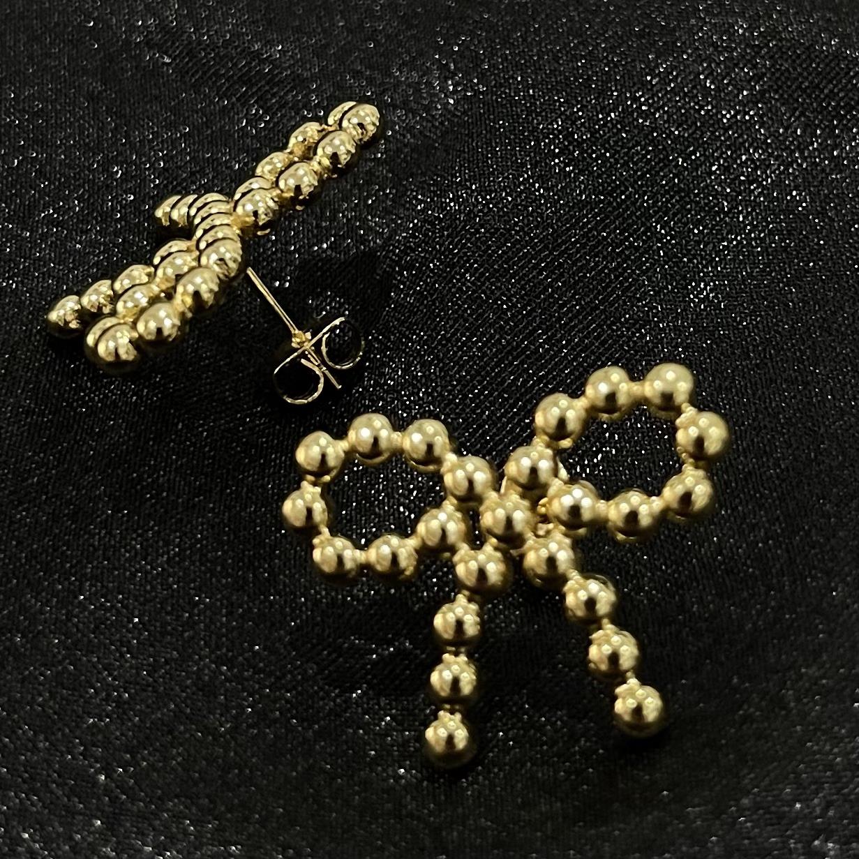 khuyên kiểu cặp vàng nơ to titan 