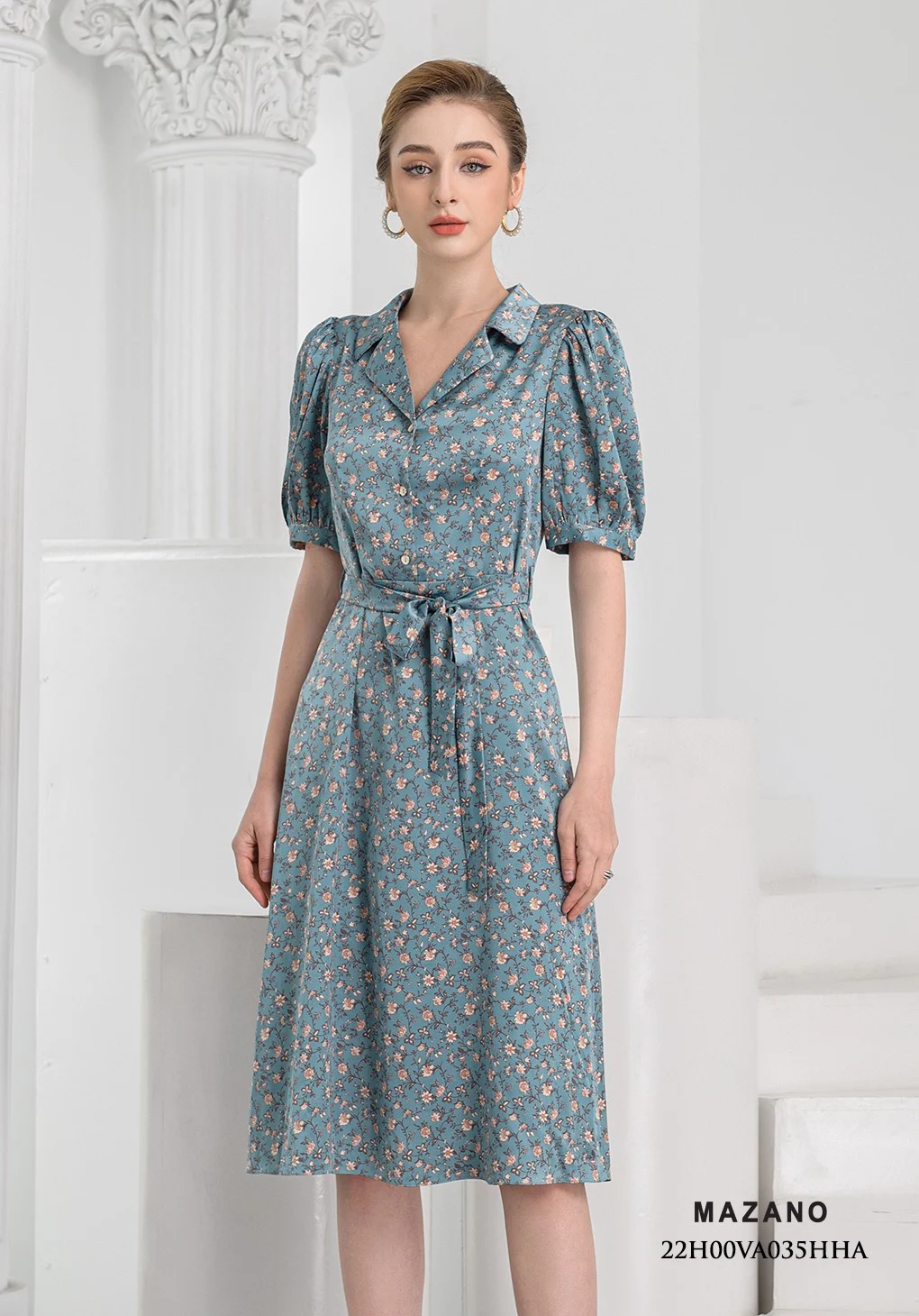 Đầm xanh họa tiết thắt nơ chân xòe