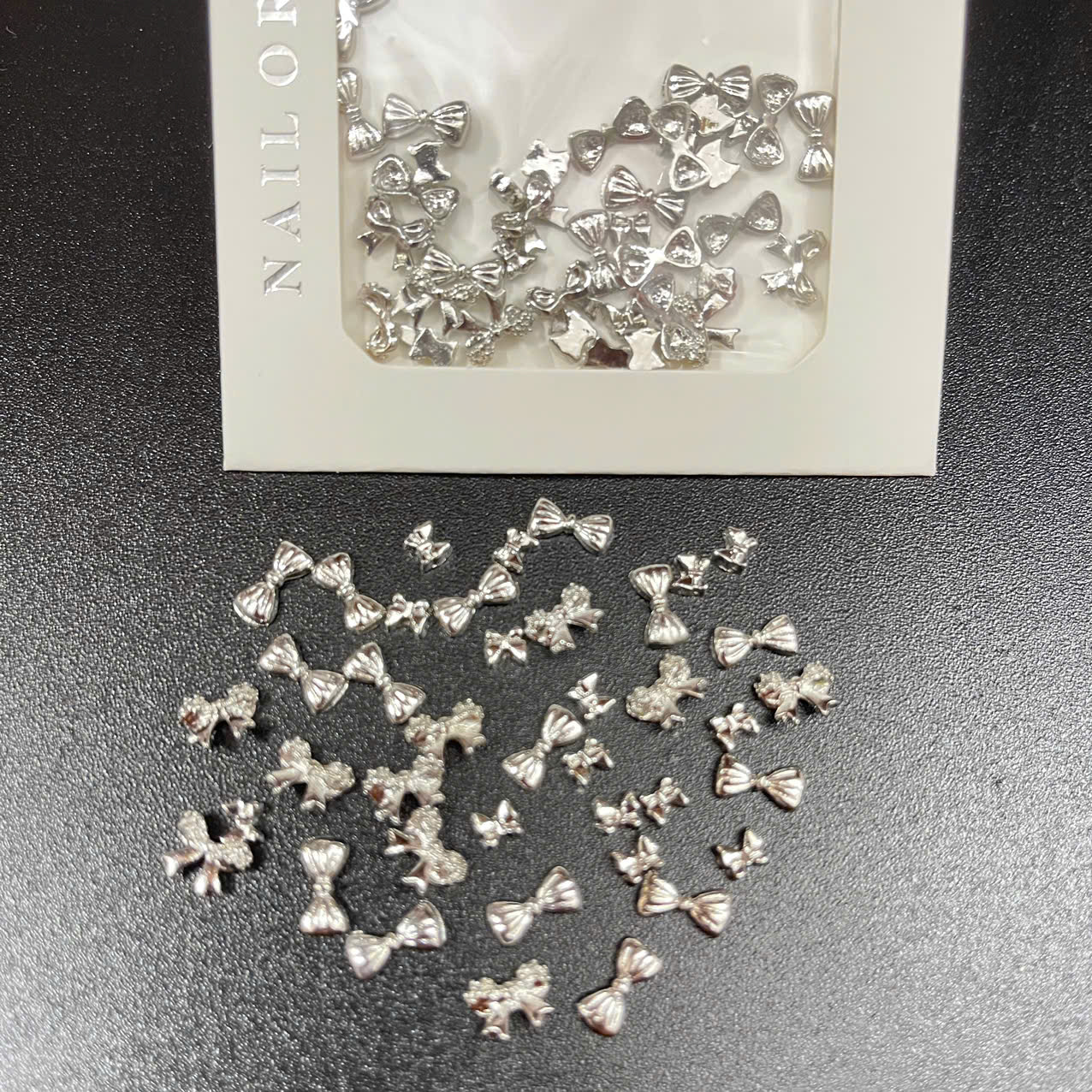 Túi charm nơ bạc - Ms 01