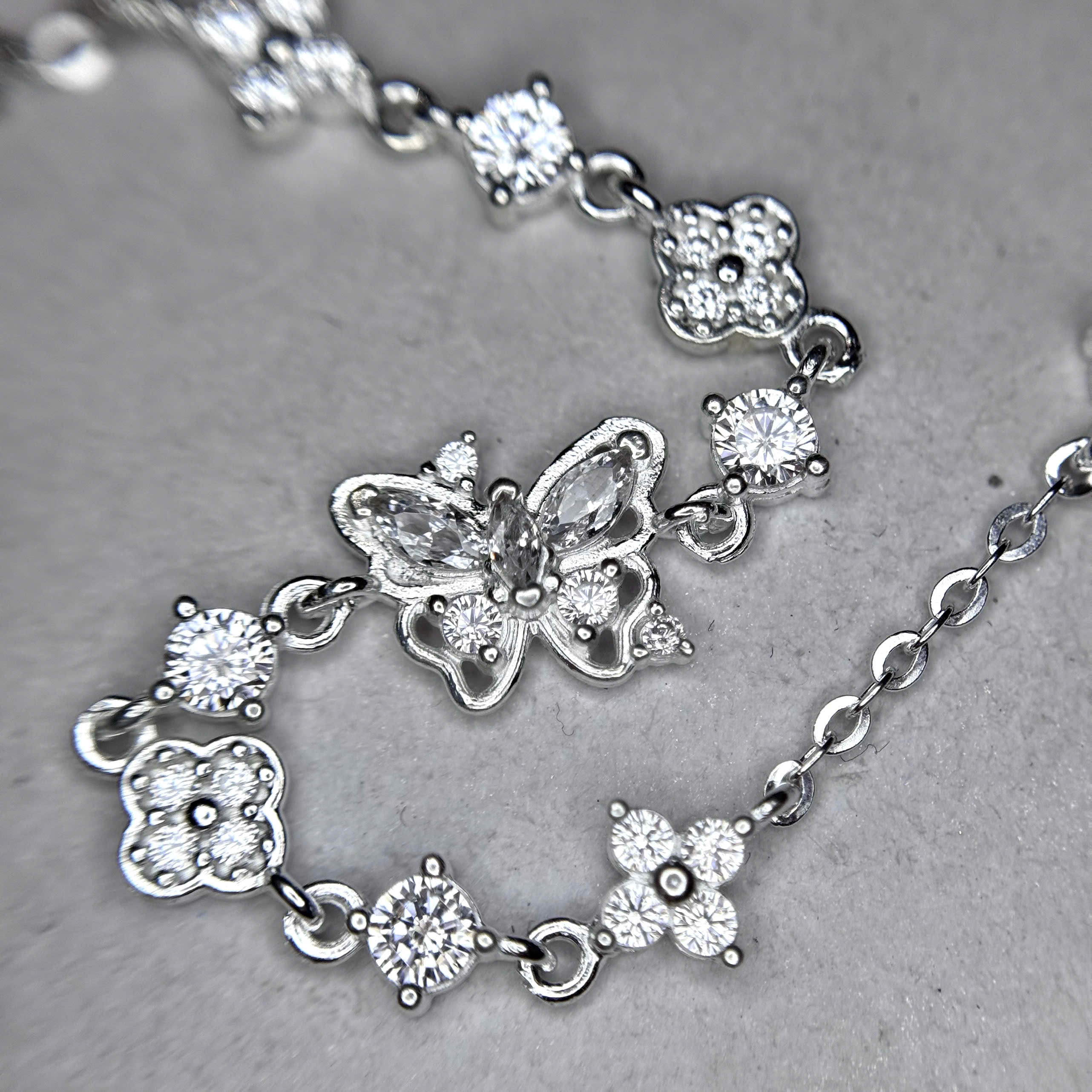 Vòng tay bạc xi bạch kim bướm vancleef trắng