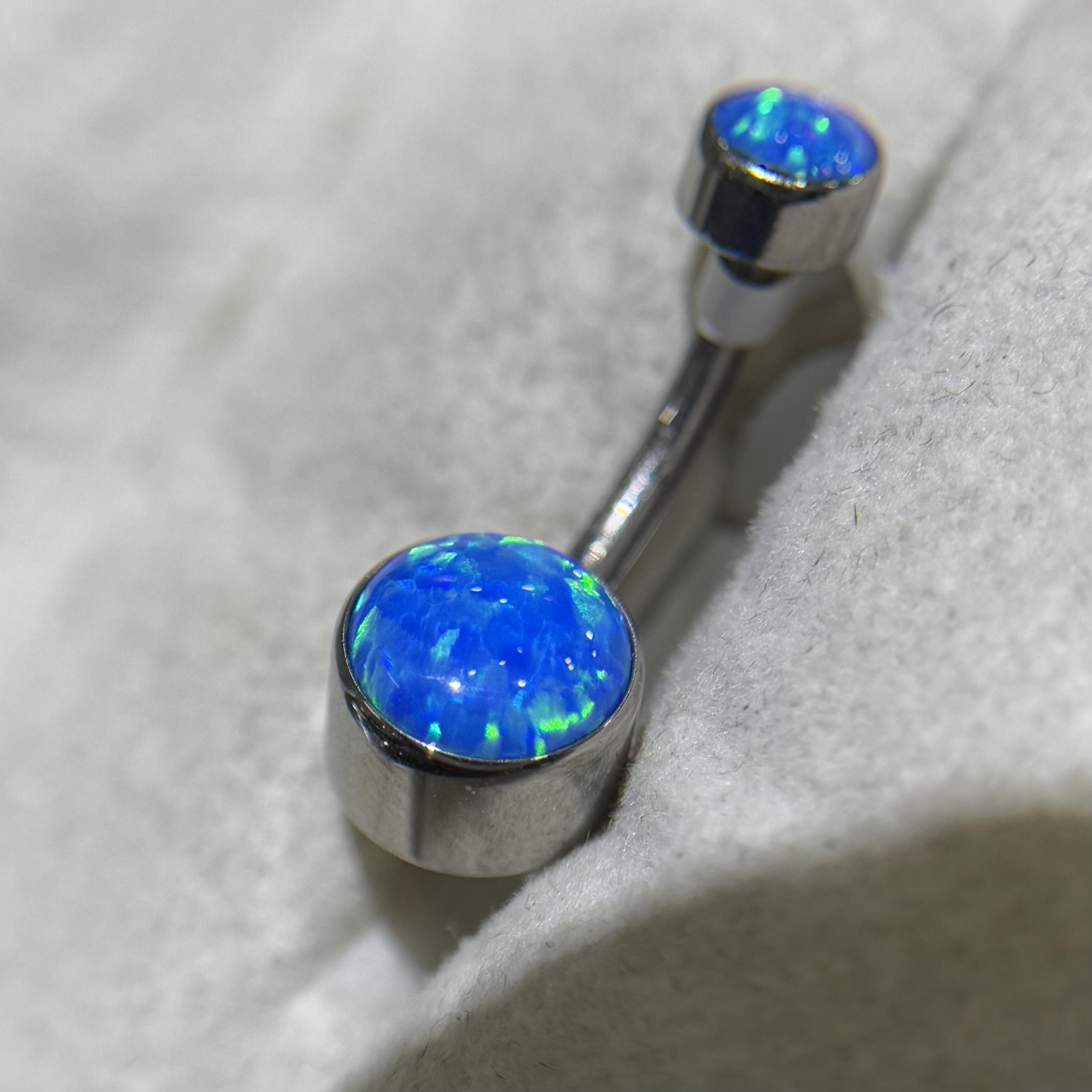 rốn titan hình trụ đá opal xanh dương.