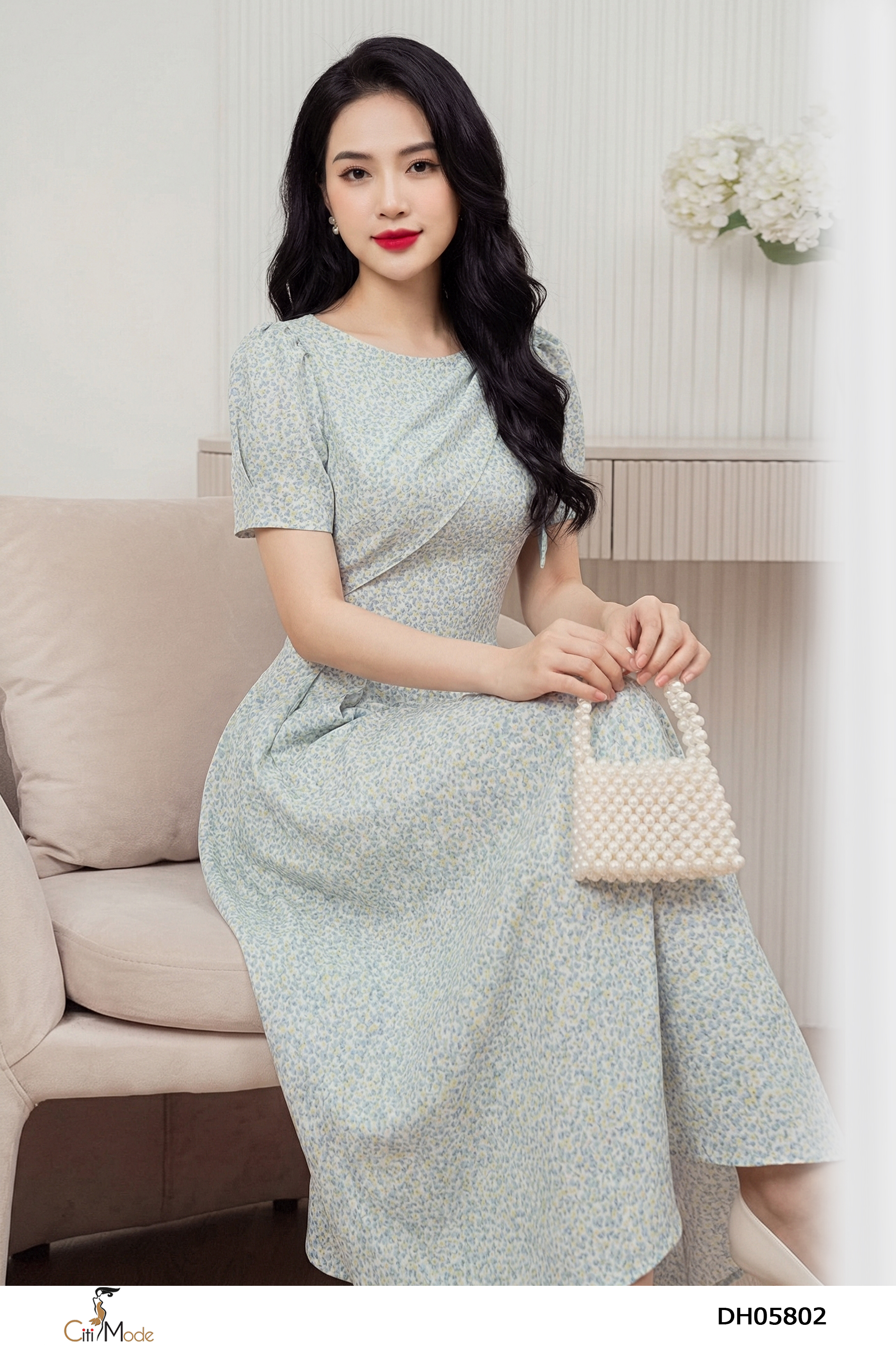 Đầm xòe hoa nhí xanh nhạt cổ vạt nơ vai cách điệu