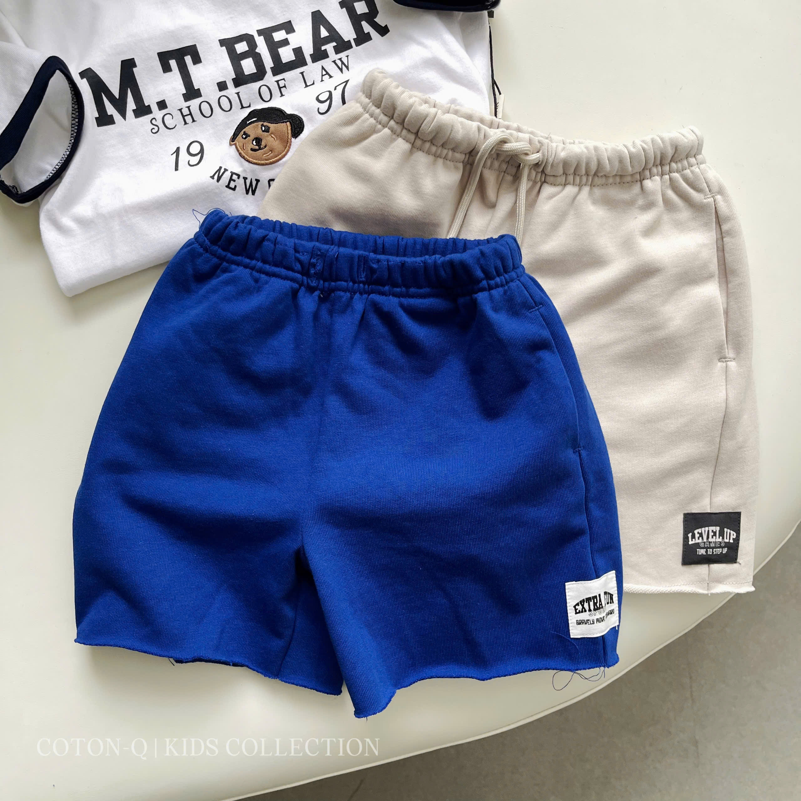 HE3 Quần short thun bé trai ( XANH )