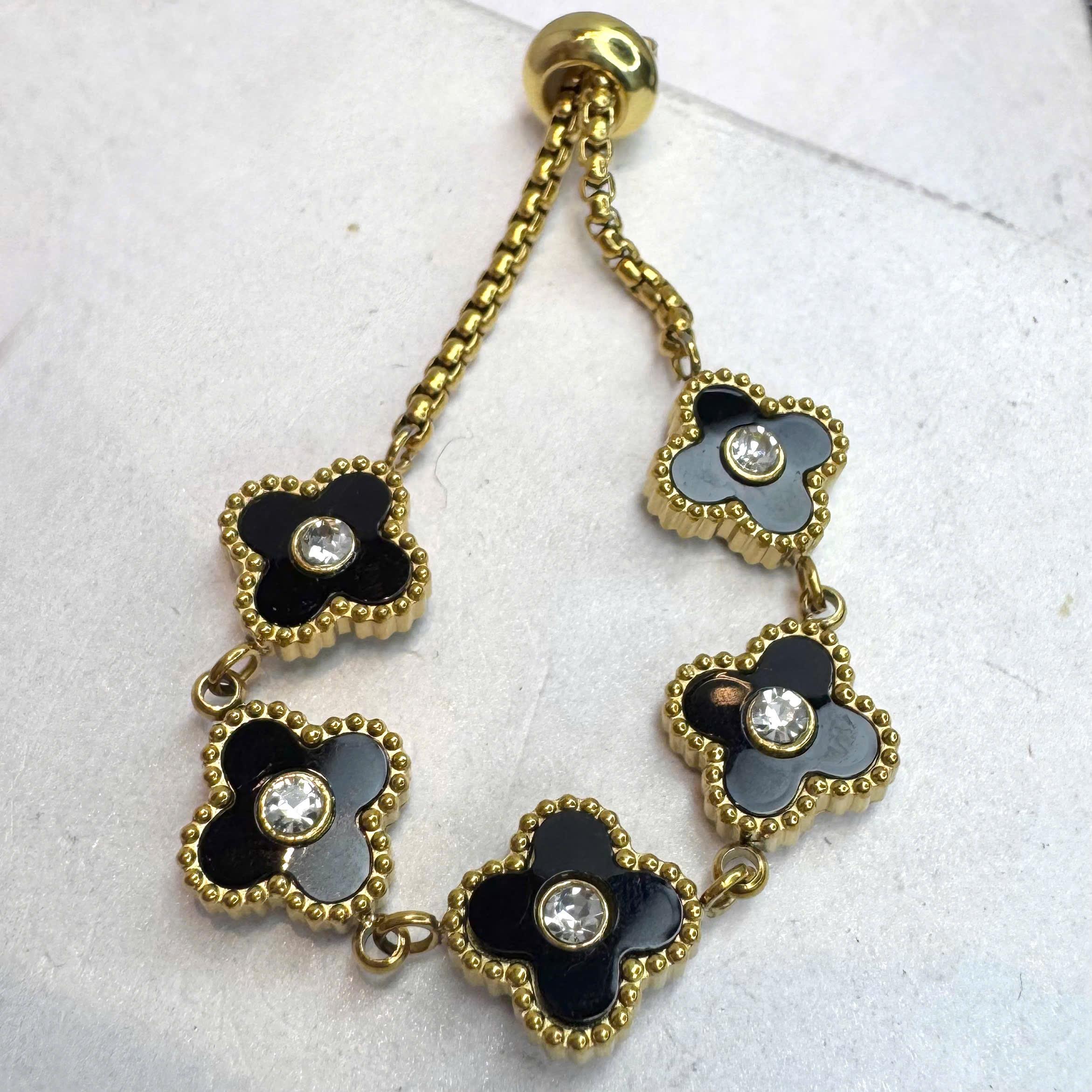 Vòng tay cỏ 4 lá đen dây vàng rút hợp kim