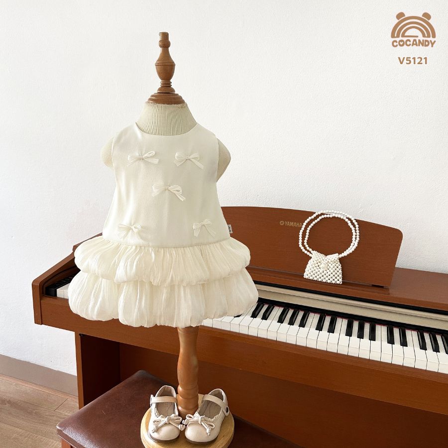 Váy cộc BE 2 tầng tơ óng đính nơ