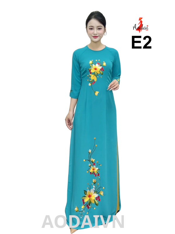 Áo dài thêu E2 Tằm Ý màu xanh ngọc cổ tròn tay lỡ thêu hoa vàng