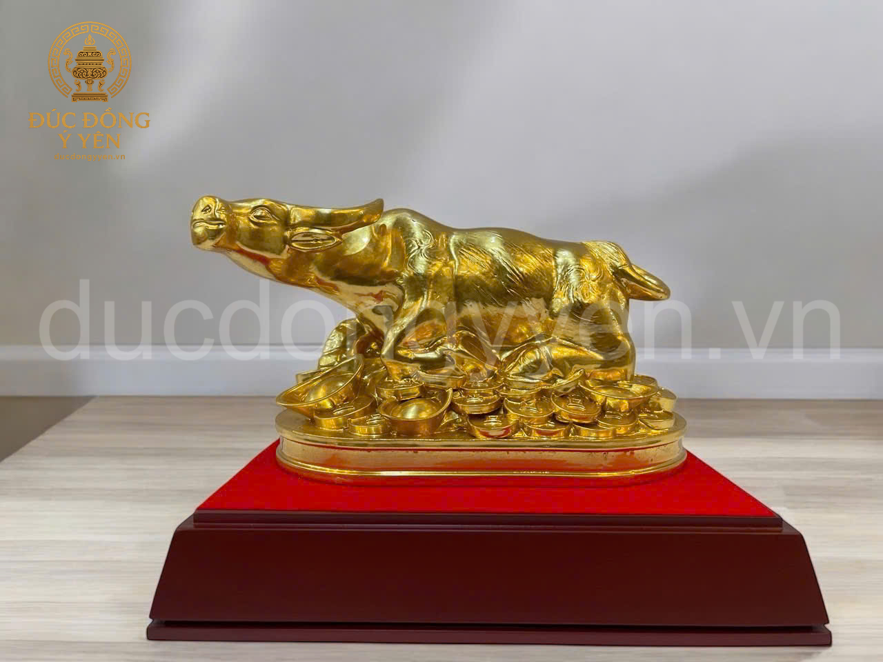 Tượng trâu  nằm tiền thiếp vàng 9999