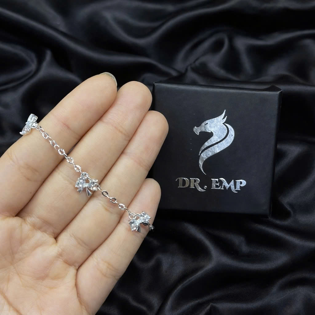 Vòng tay bạc xi kim nơ tim trắng