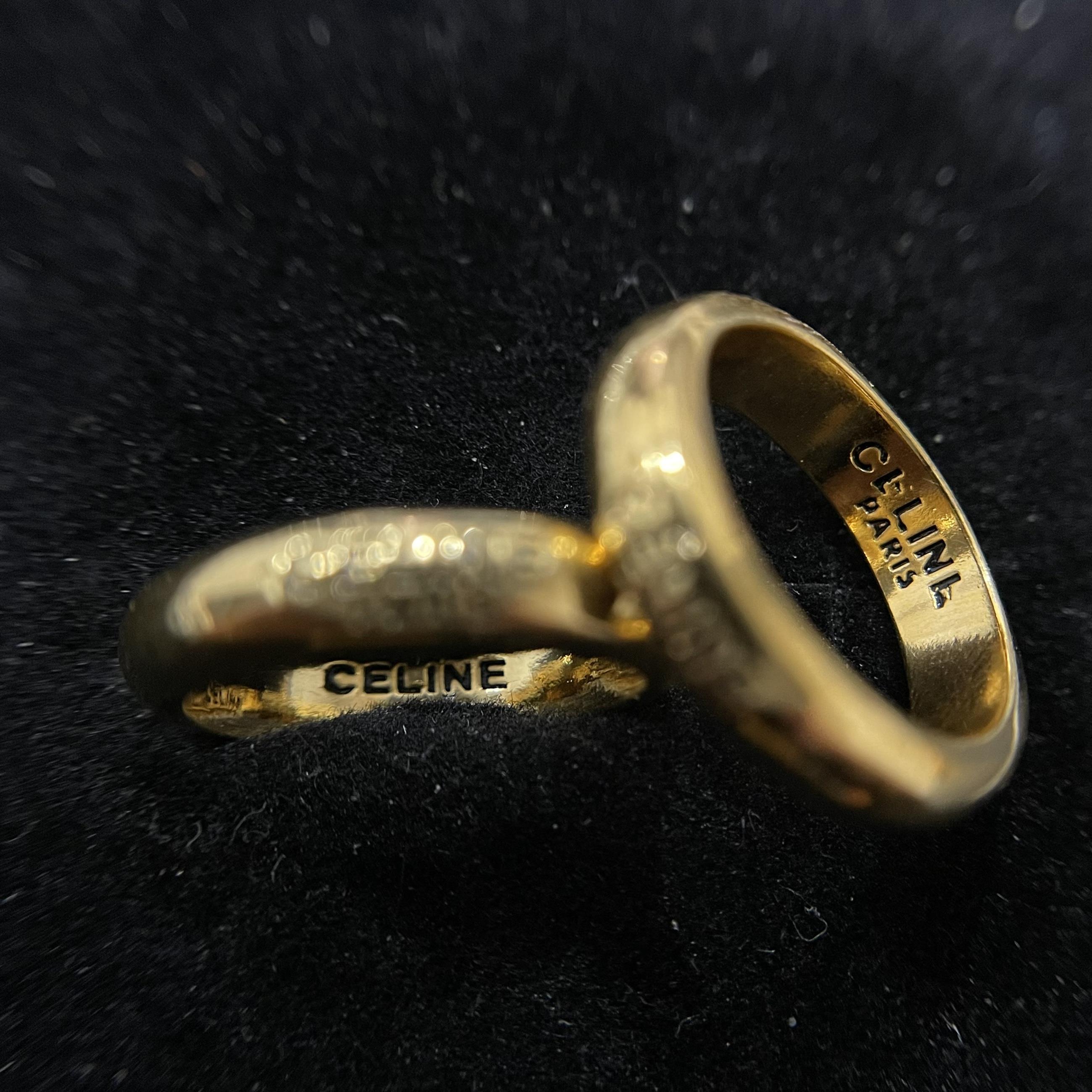 nhẫn kiểu titan khắc chữ Celine Paris màu vàng có khắc phía trong size 6