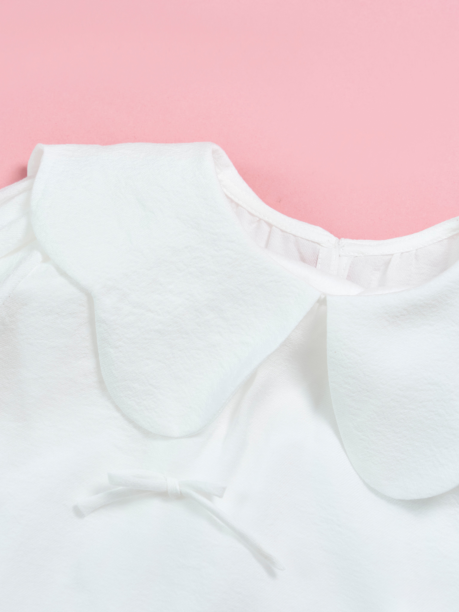 Áo tay bèo cổ lượn đính nơ