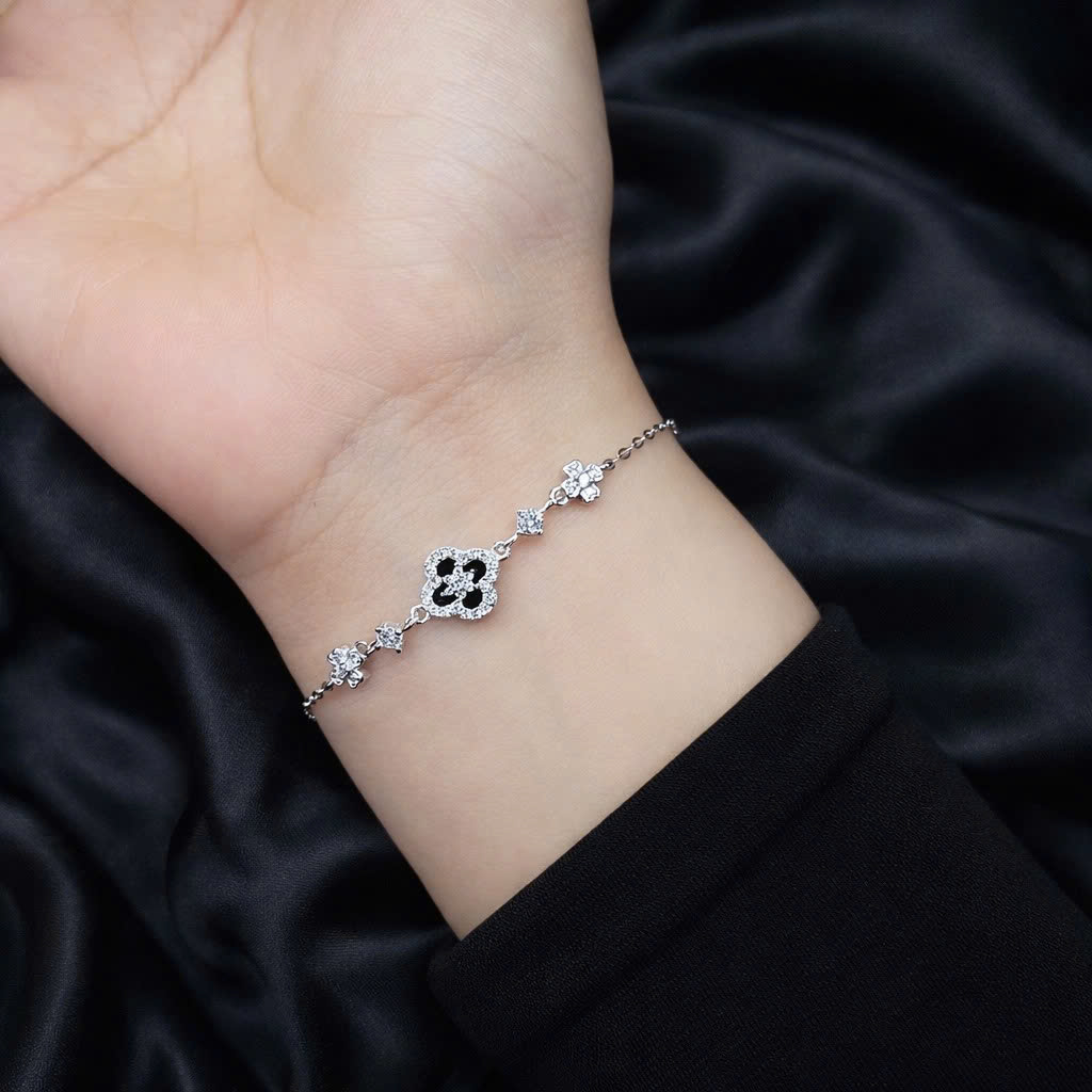 Vòng tay bạc xi kim Vancleef đen nhụy hoa trắng