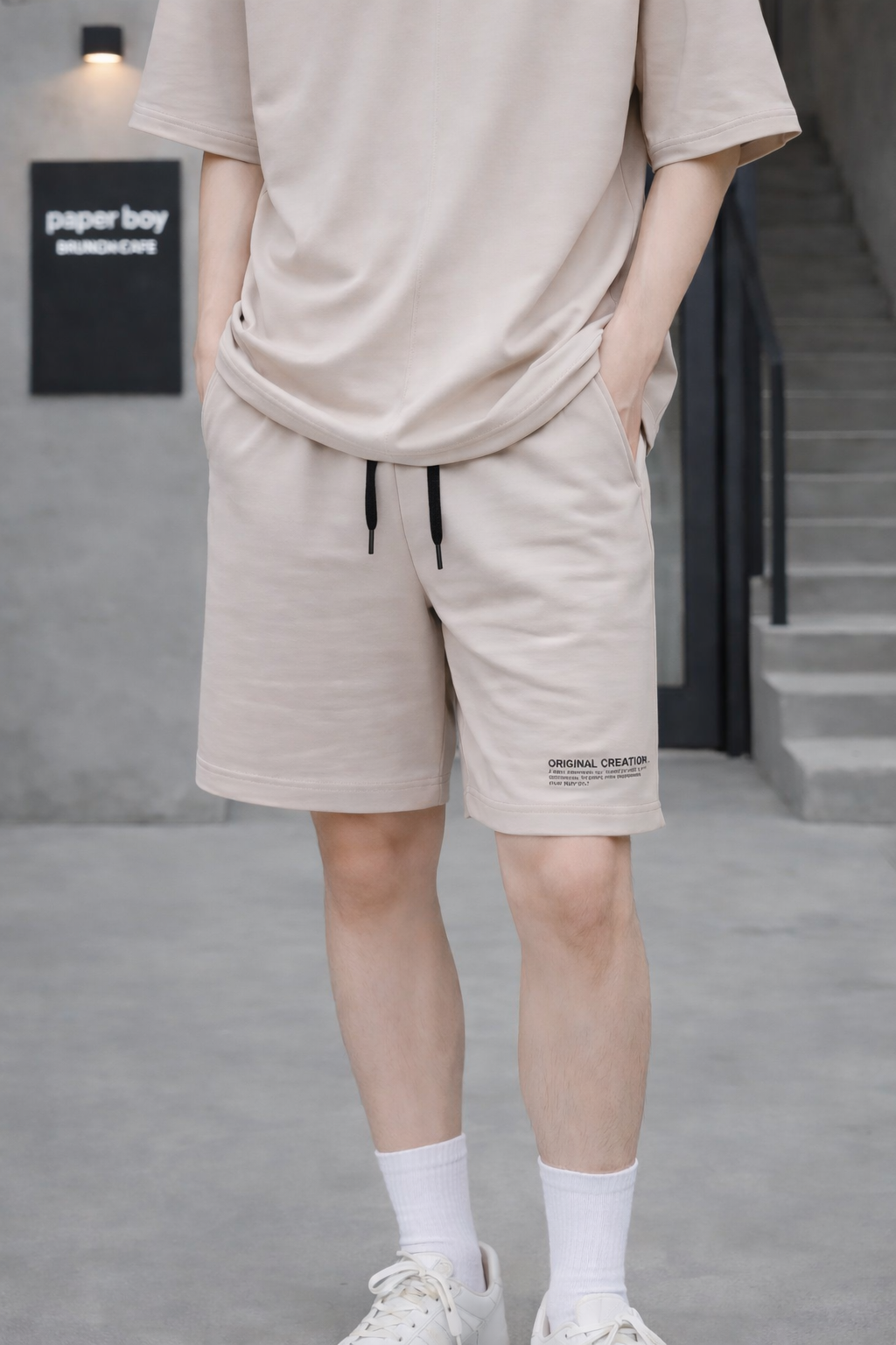 Quần short nỉ bé trai màu be in chữ