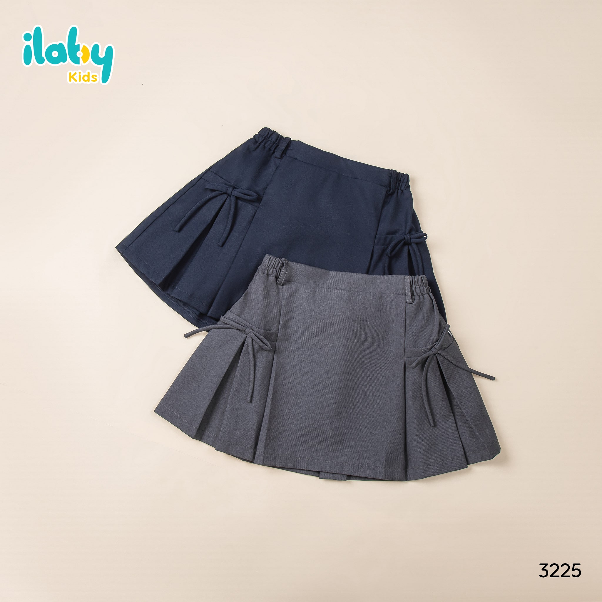 Chân váy xếp ly may cơi đính nơ