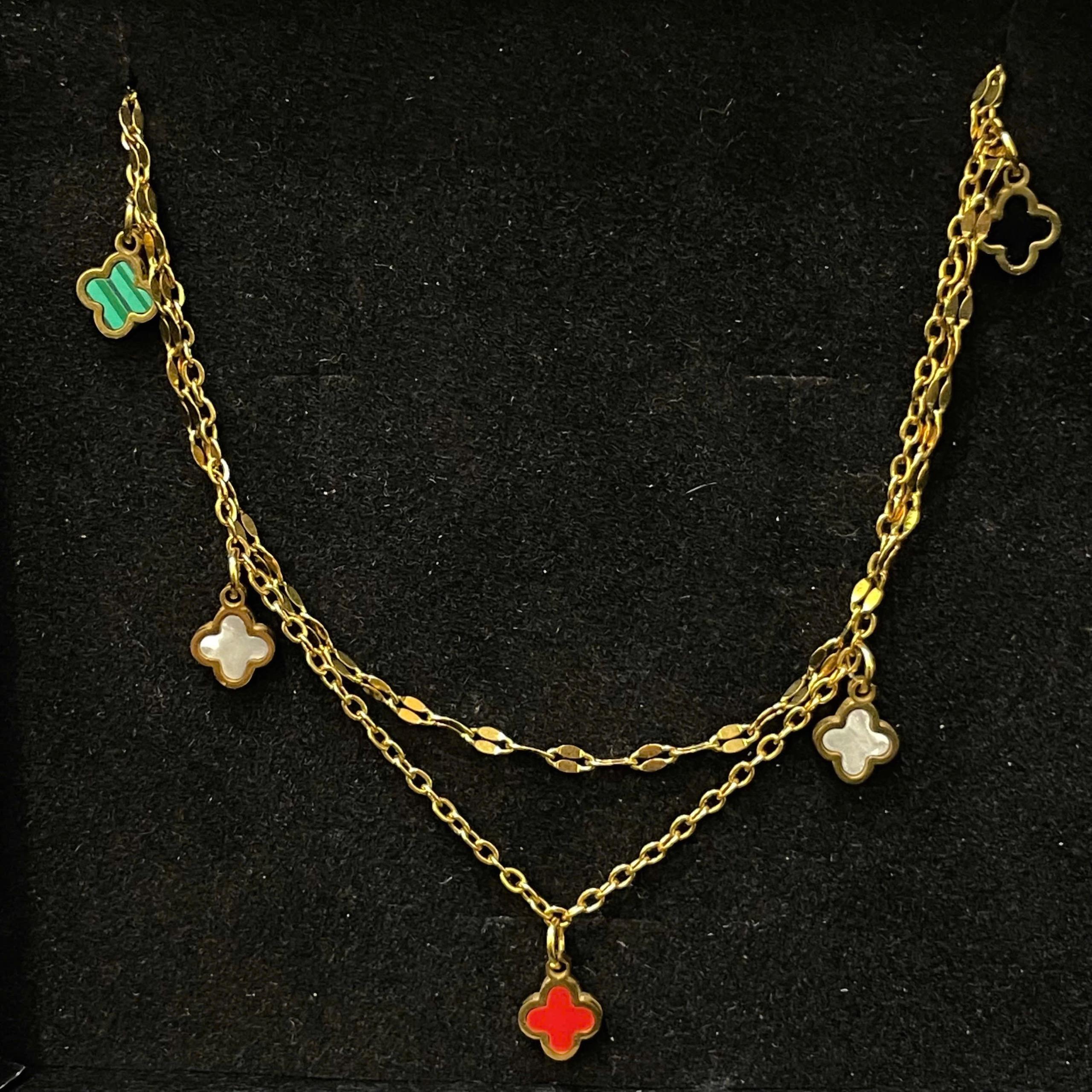 lắc chân titan vàng xích nhỏ năm bông hoa bốn cánh.