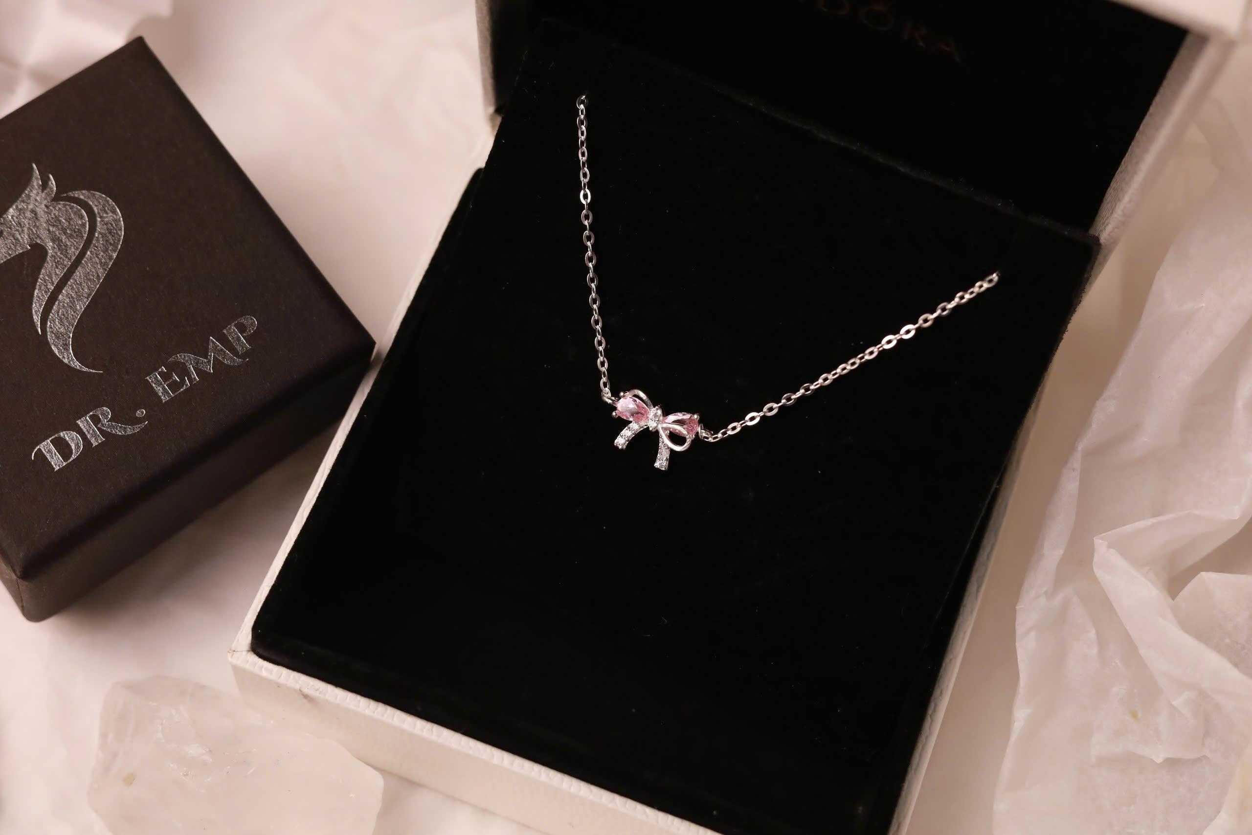 Vòng cổ bạc nơ đính đá hồng xi bạch kim