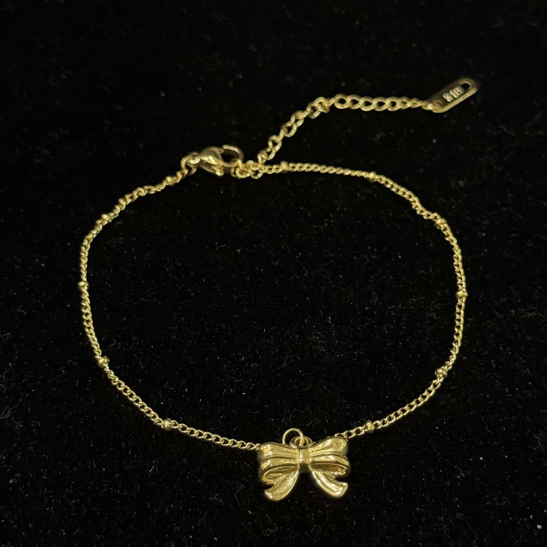 lắc chân titan sợi vàng mảnh chiếc nơ dập nổi _thumbnail_2