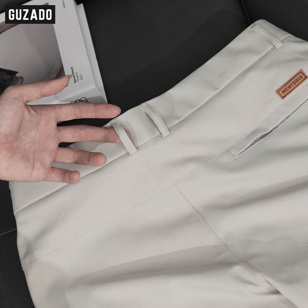 A hand reaching out to a pair of pants

AI-generated content may be incorrect.