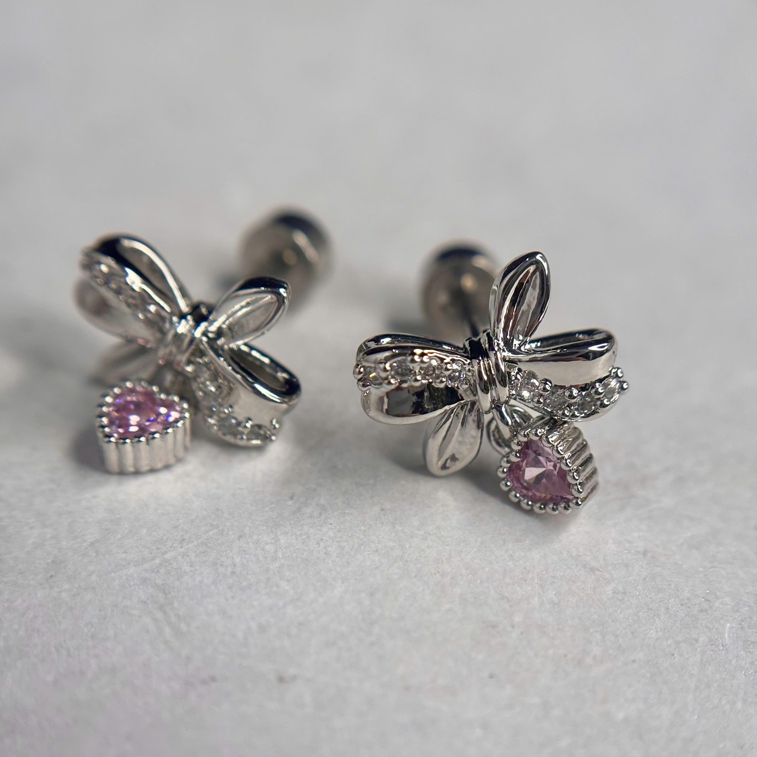 khuyên kiểu nơ rơi đá tim hồng