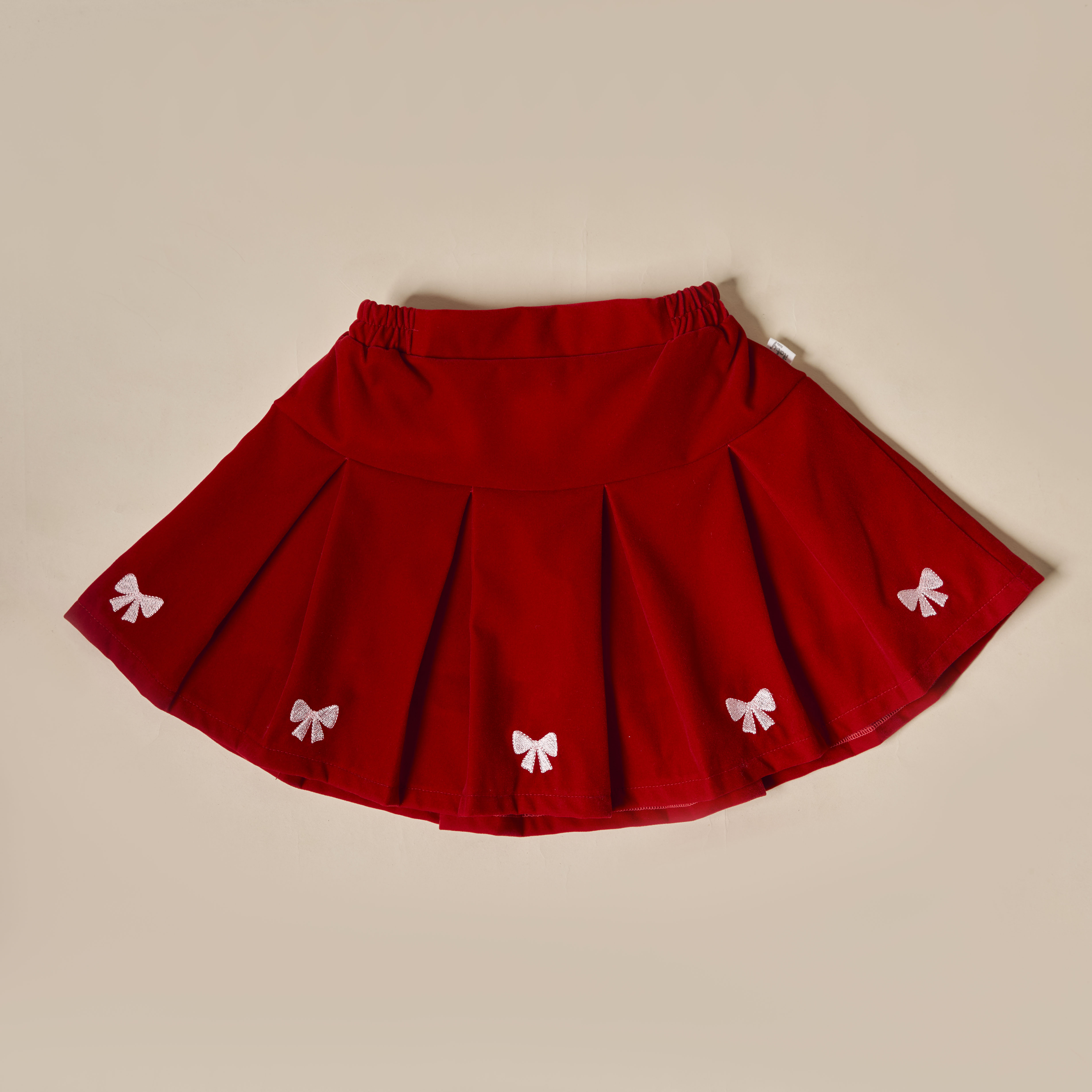 Chân váy xếp ly thêu nơ