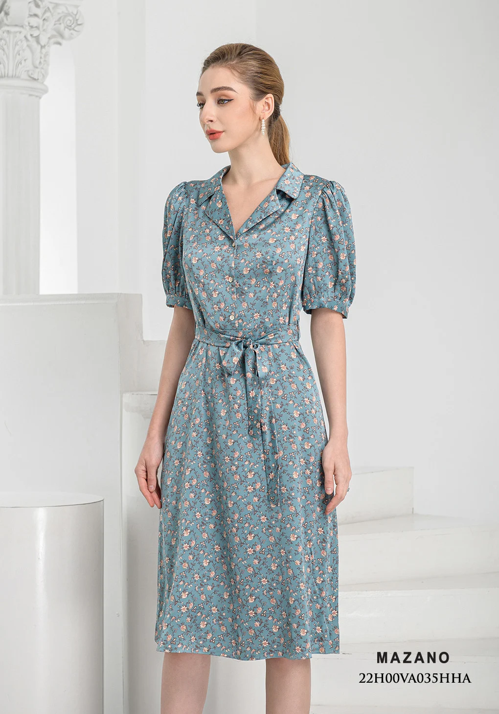 Đầm xanh họa tiết thắt nơ chân xòe