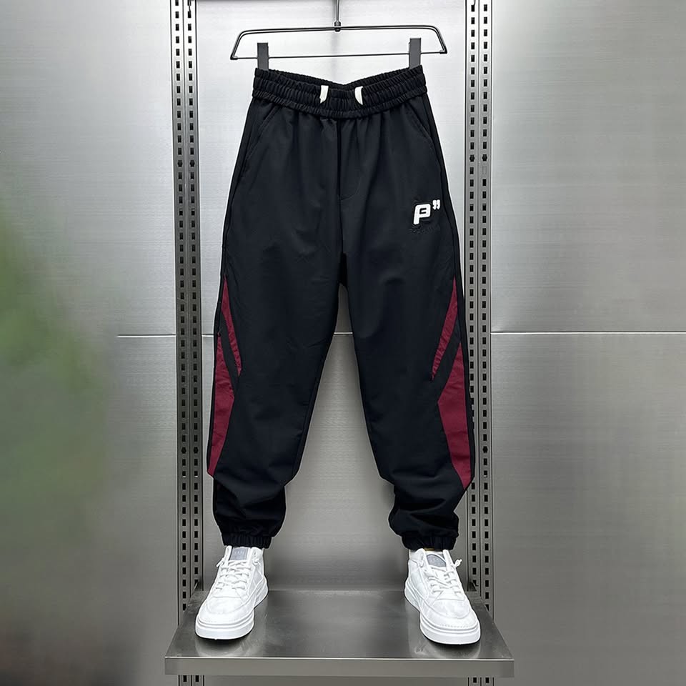 Quần Gió Jogger Unisex Cao Cấp – Vải Gió Hạt Mịn Nhẹ, Bo Gấu Co Giãn, Phong Cách Năng Động - QH05