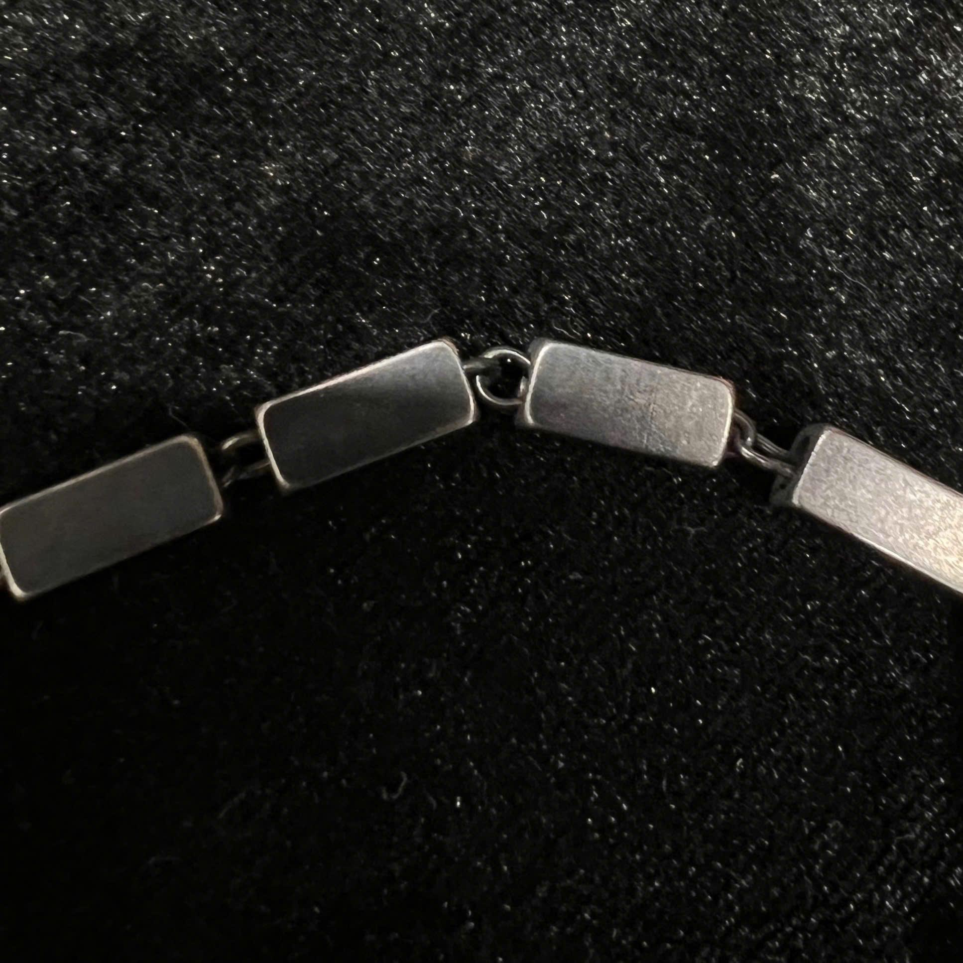 Vòng tay titan xích khối chữ nhật đen 18 23cm.