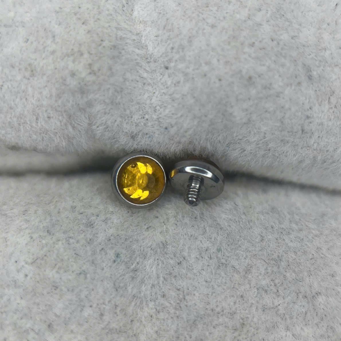 Charm cấy thép y tế cam nhạt s4