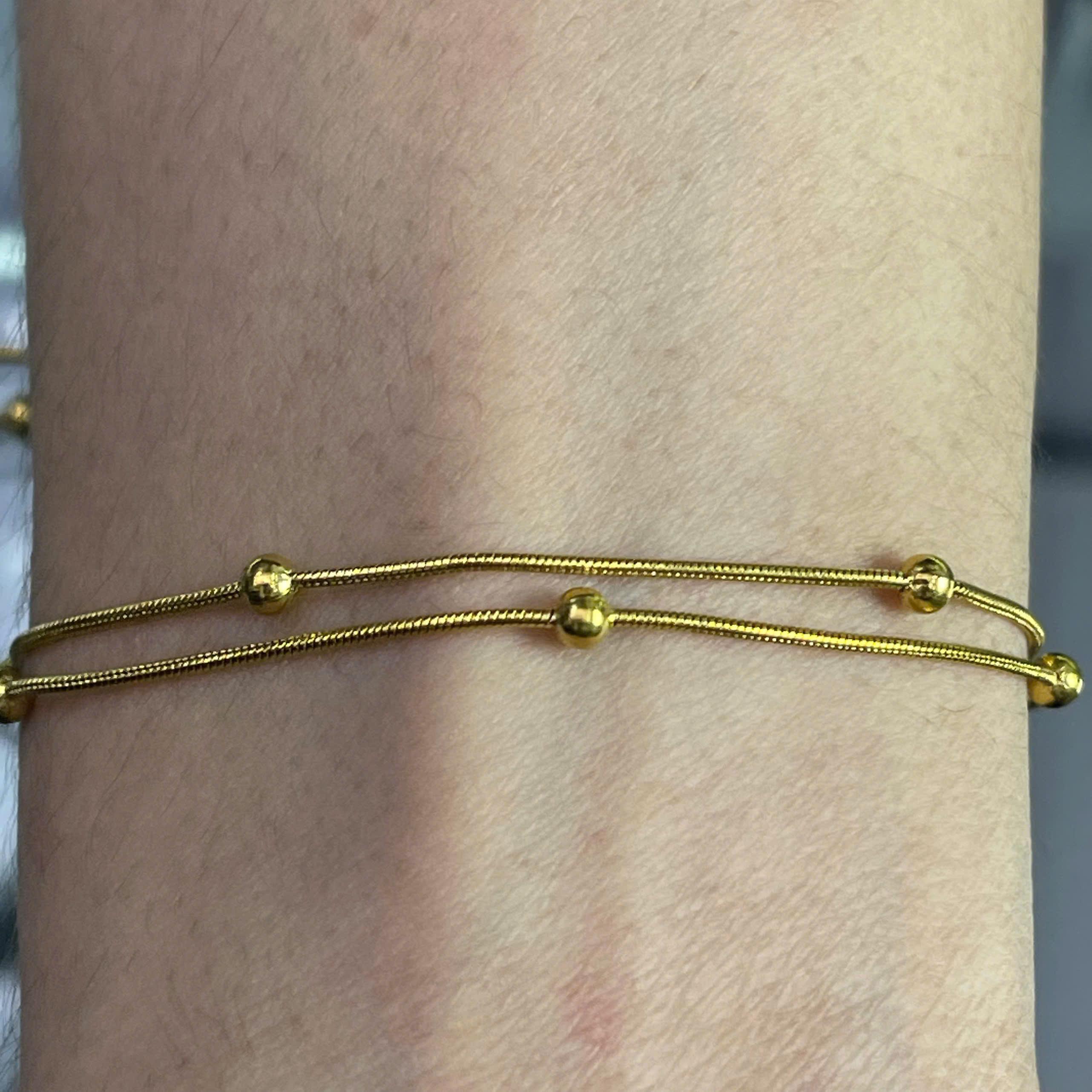 lắc chân titan sợi vàng hai dây charm bi nhỏ._thumbnail_1