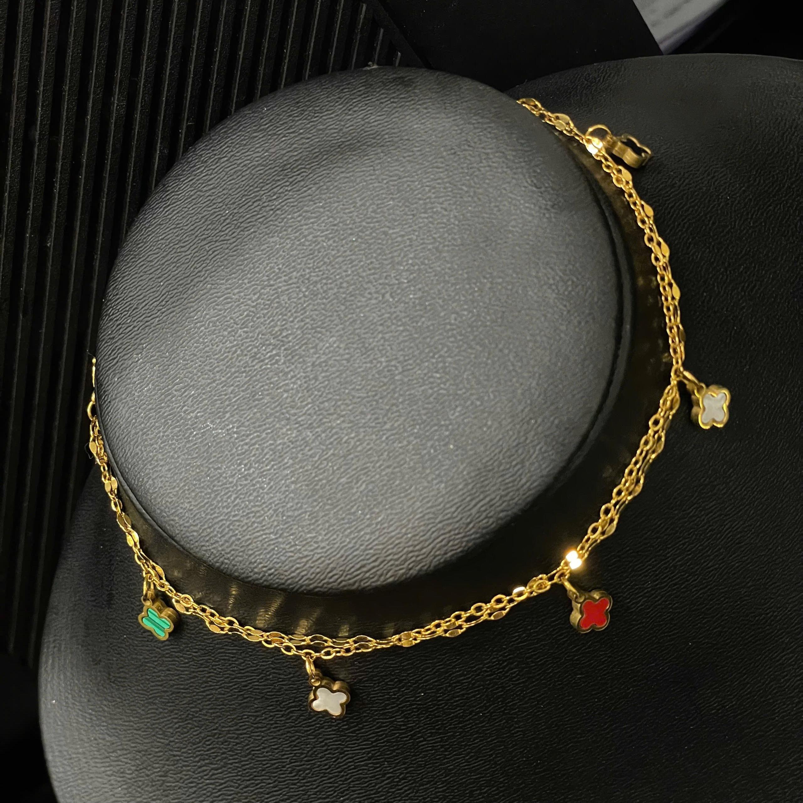 lắc chân titan vàng xích nhỏ năm bông hoa bốn cánh._thumbnail_2