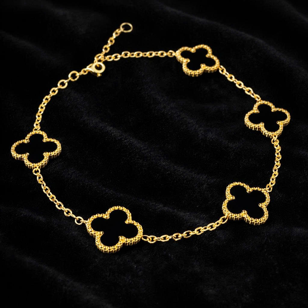 Vòng tay van cleef đá đen lớn màu vàng