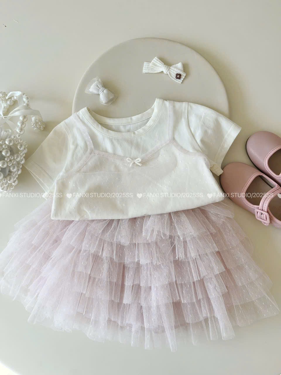 (A16) Áo thun mềm tay bo có họa tiết ren màu trắng kem QCCC mẫu hè 2025 cho bé gái_thumbnail_0