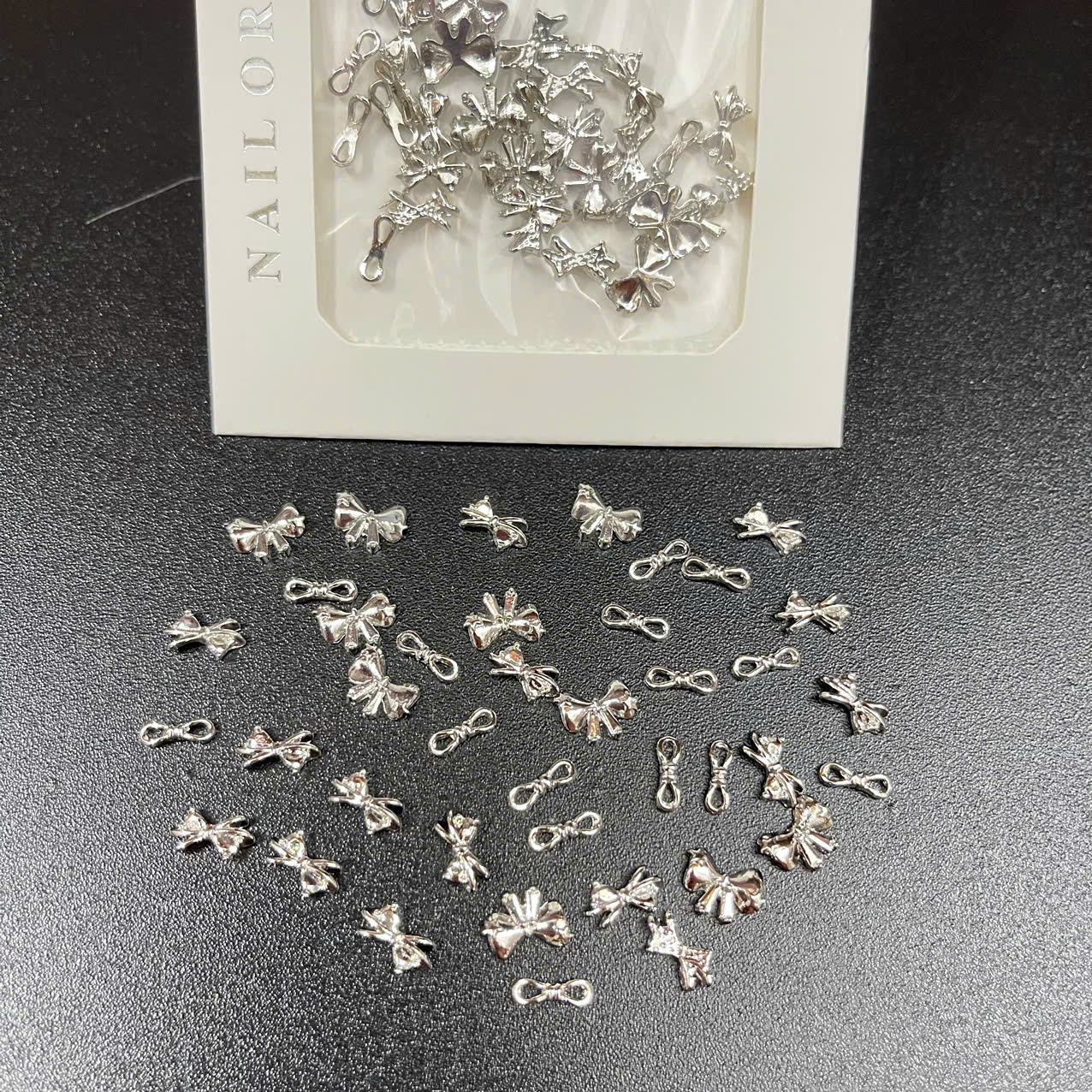 Túi charm nơ bạc - ms 02