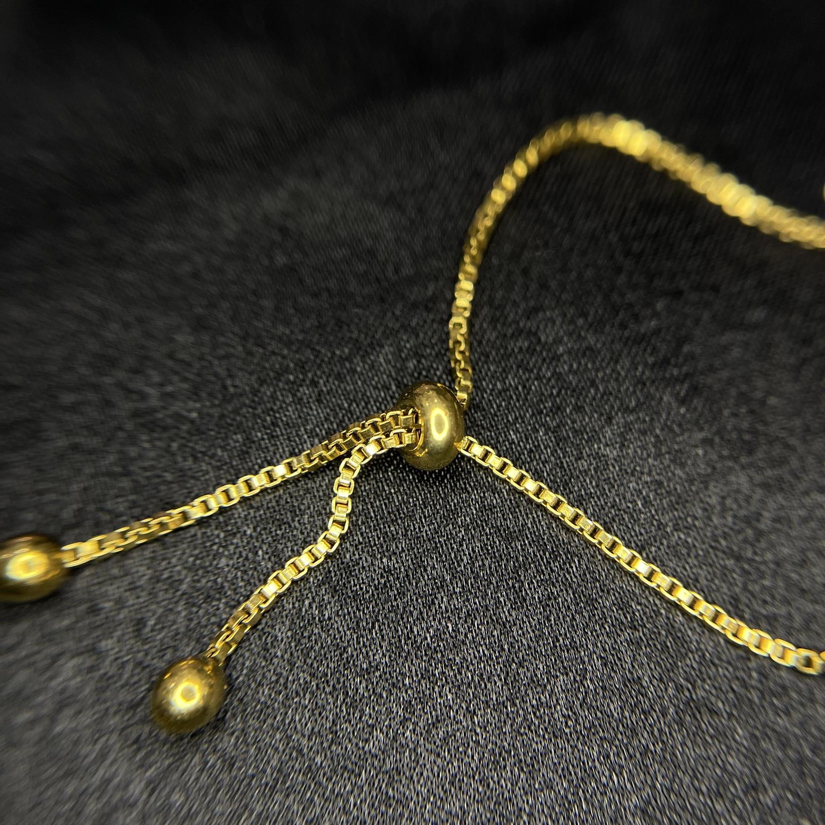 vòng tay titan ba hoa màu vàng guci dây rút. _thumbnail_1