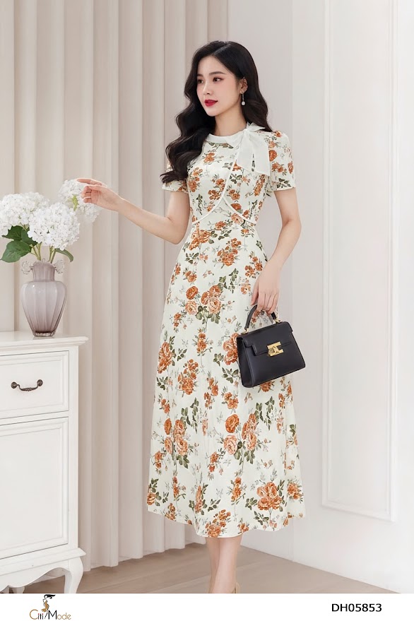 Đầm xòe vải họa tiết , tà bong ngực, cổ phối trắng thắt nơ lệch