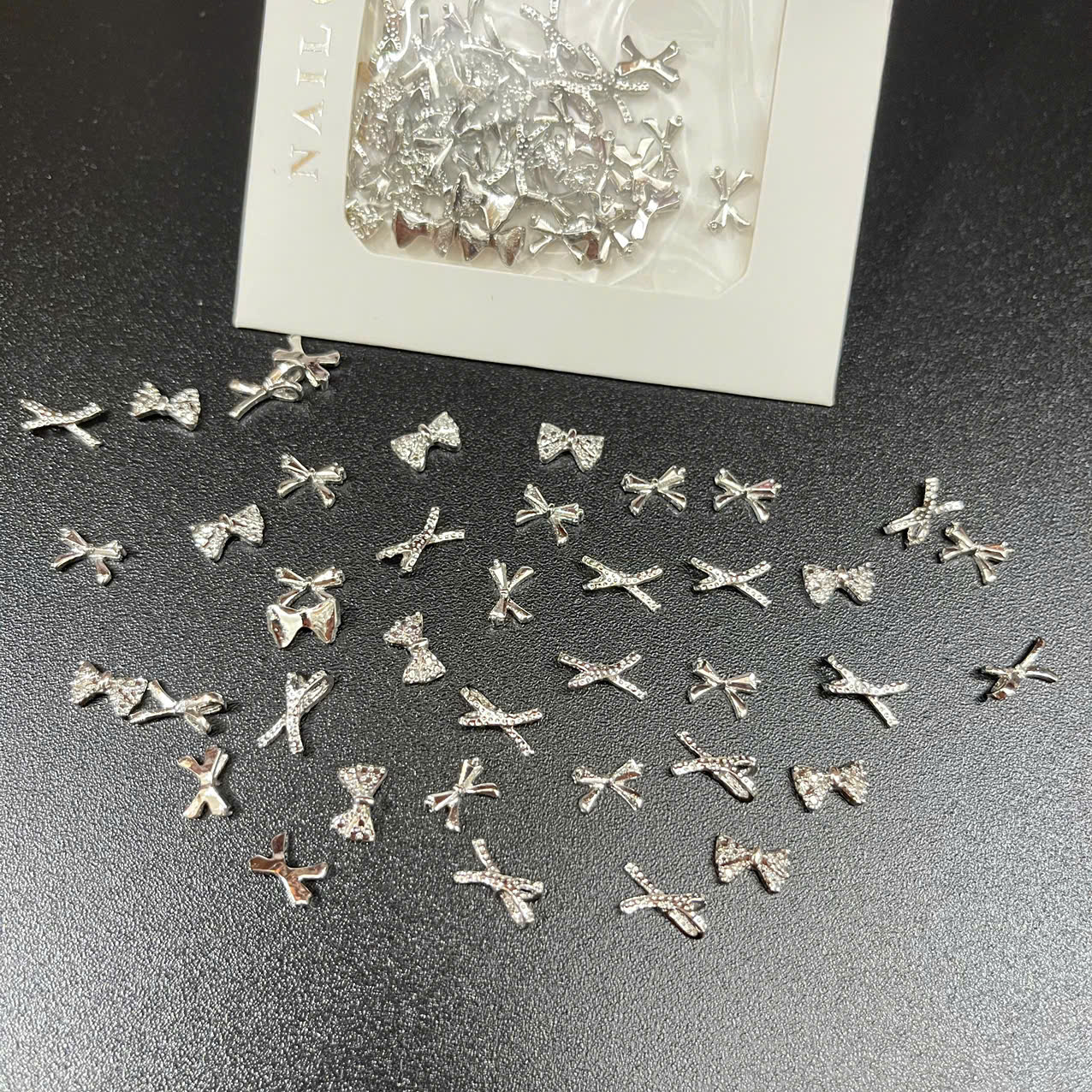 Túi charm nơ bạc - ms 03