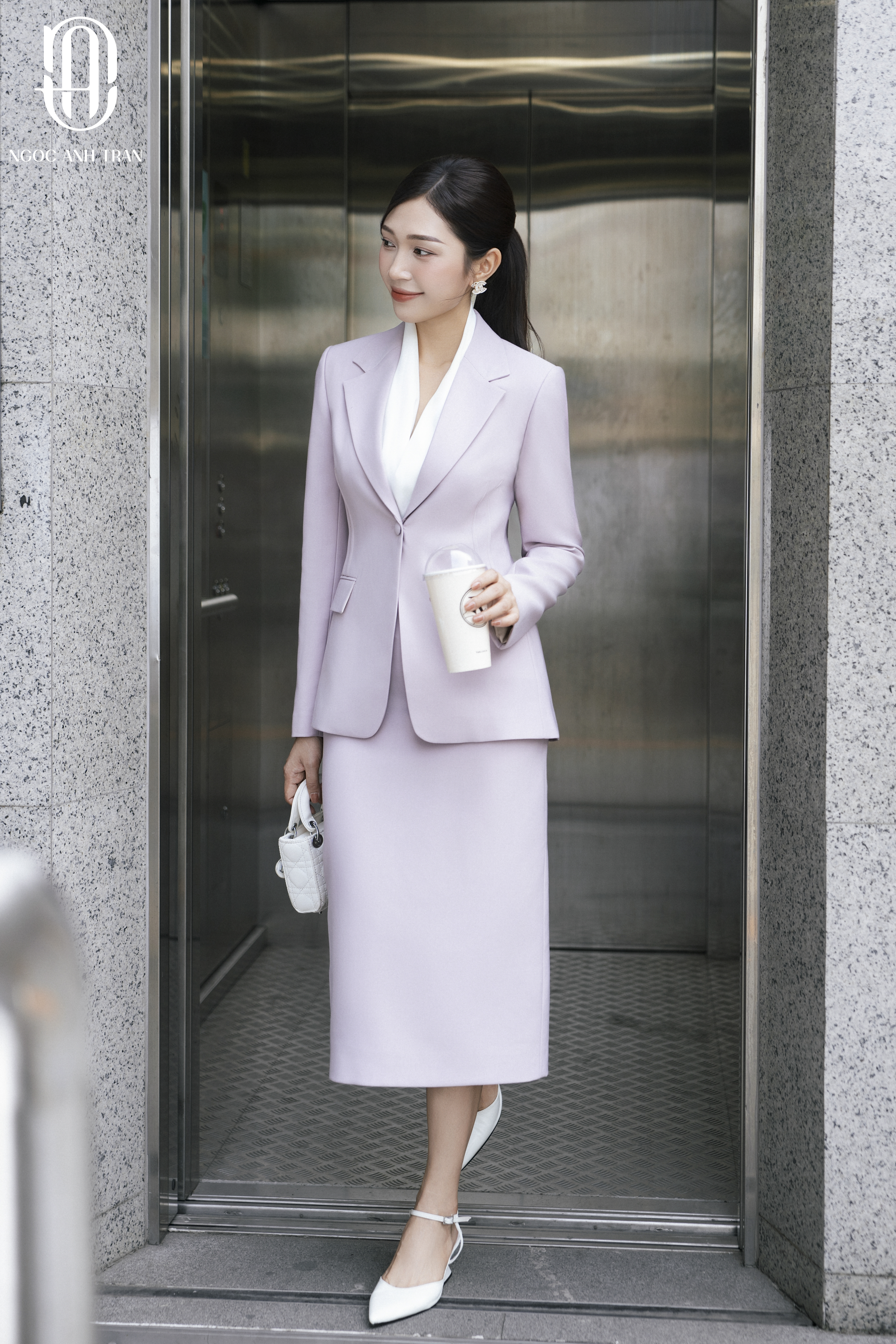 V052 - Set áo vest tím pastel phối chân váy