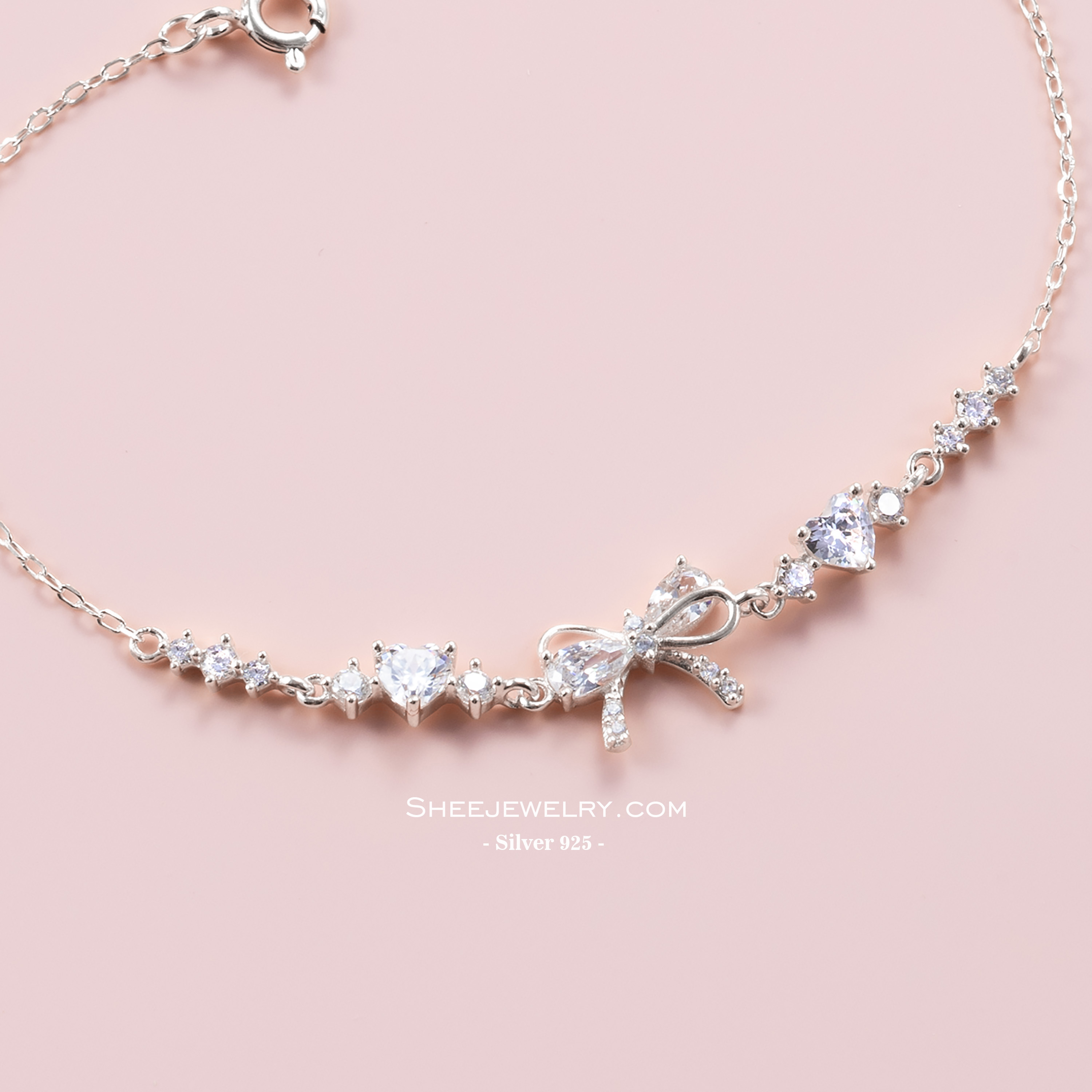  icon video play     Chia sẻ:  0 Vòng tay bạc nữ Shee Silver 925 đính đá hồng tim & nơ – phụ kiện xinh xắn, tôn da, quà tặng lãng mạn