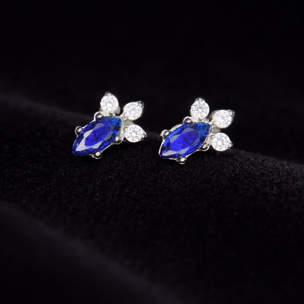 Khuyên kiểu titan đá xanh 3 đá tam giác