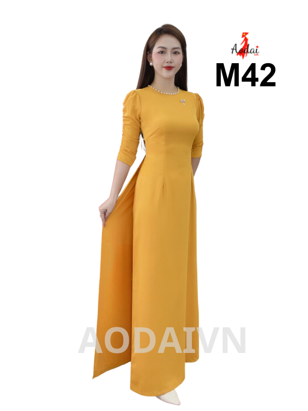 M42 Áo dài lụa Mỹ vàng tay rúm cổ tròn tay bồng đính hạt