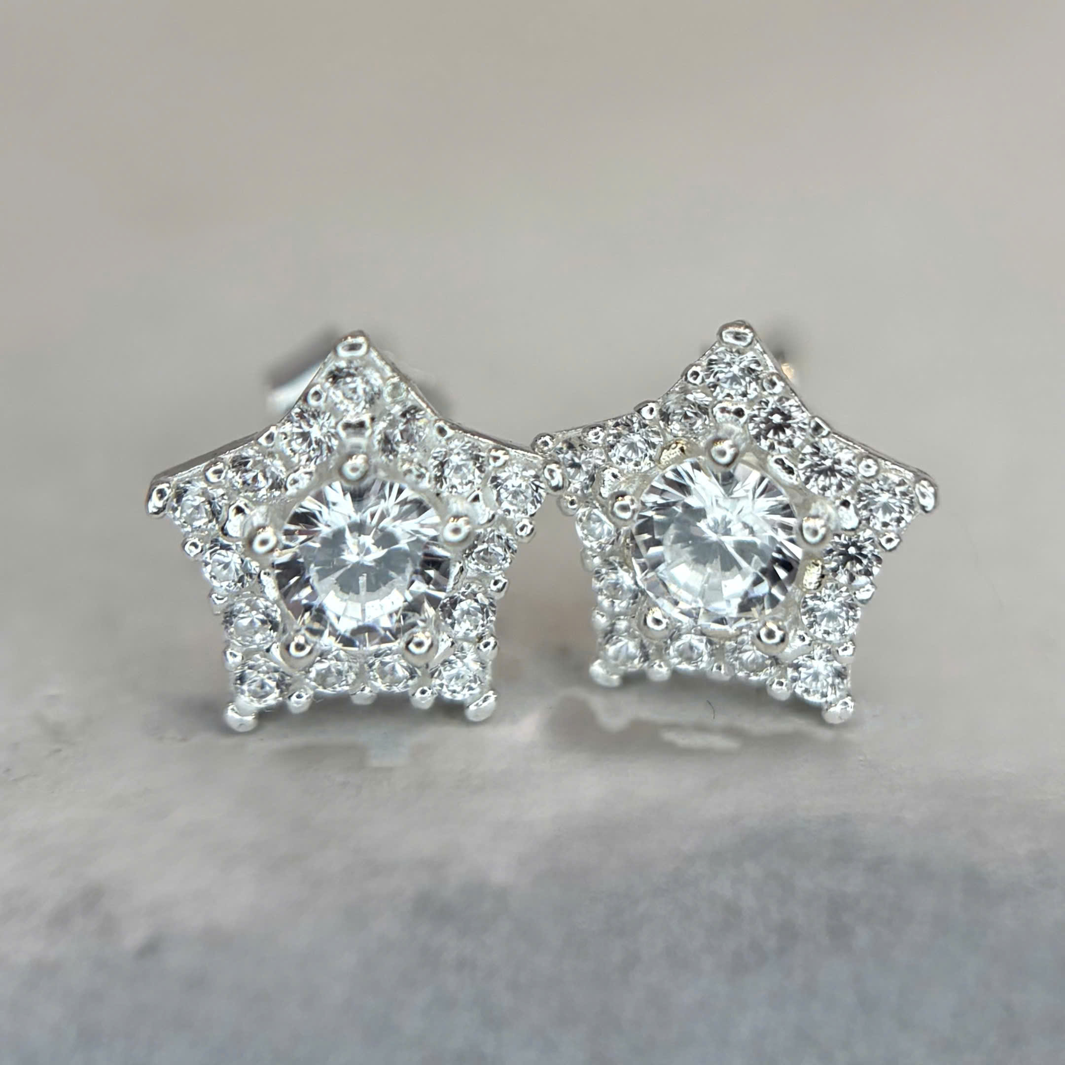 khuyên kiểu bạc xi kim sao đá trắng