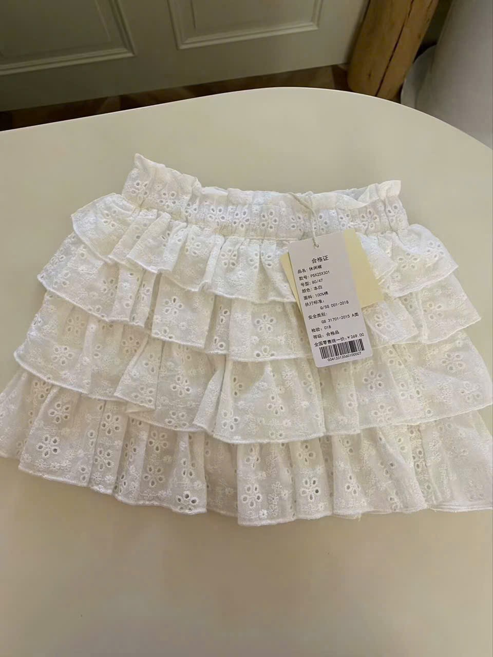 A29 - Chân váy ren trắng tầng hoa nhí hãng PK (Sz80-120)