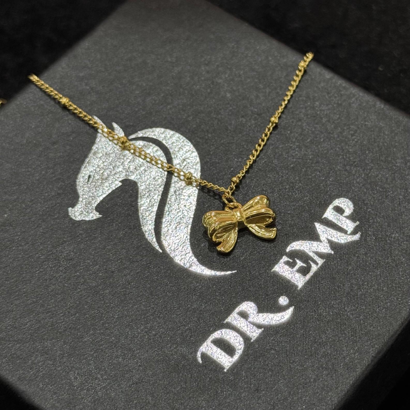 lắc chân titan sợi vàng mảnh chiếc nơ dập nổi 