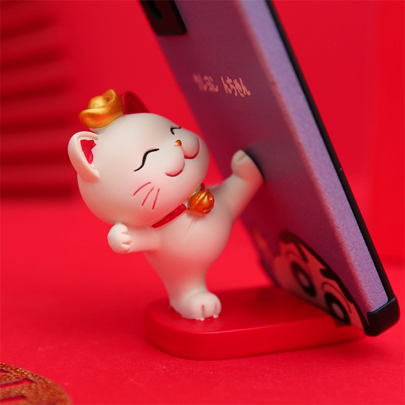 Mèo đỡ điện thoại