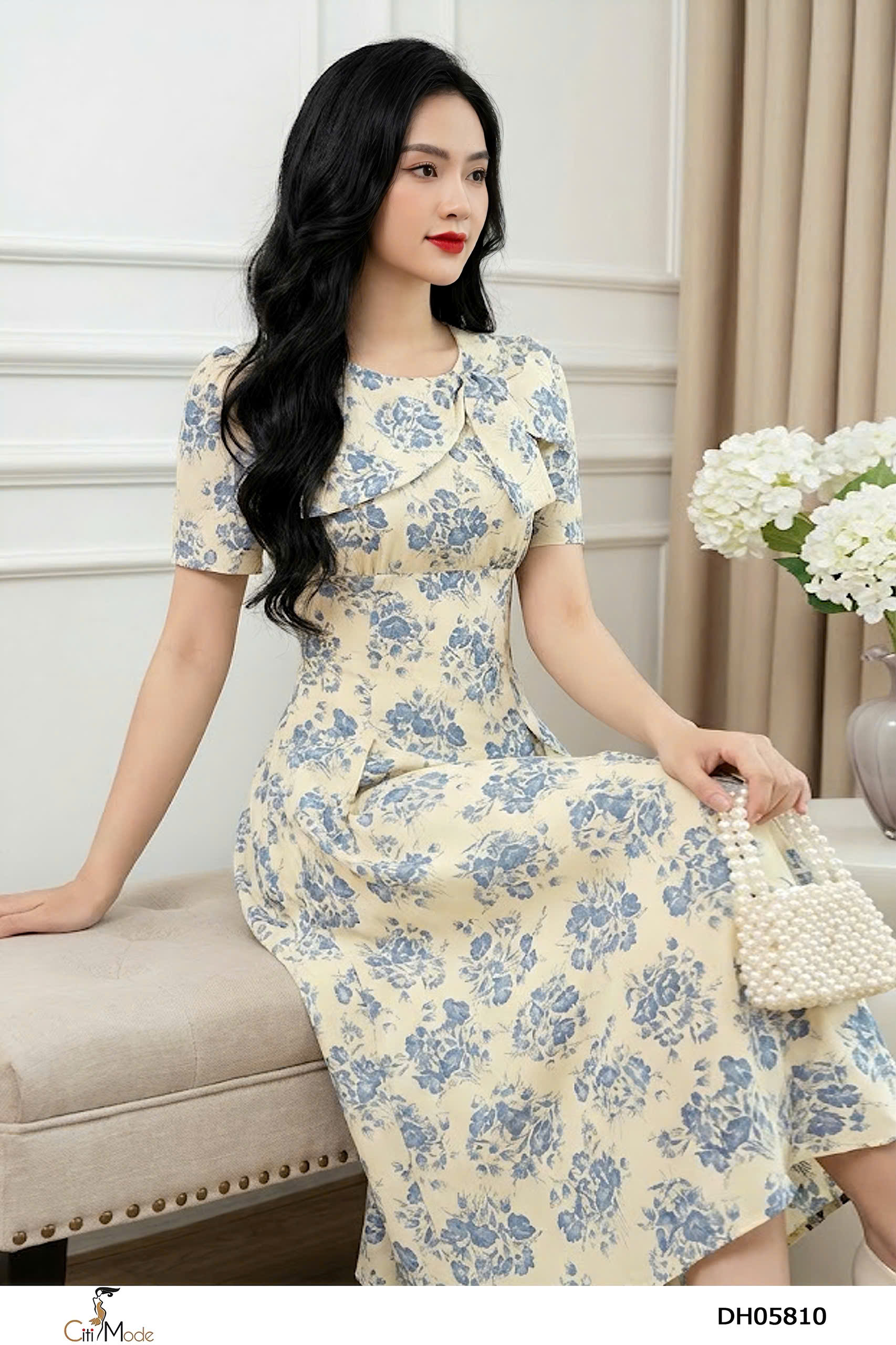 Đầm xòe hoa xanh cổ vạt nơ cách điệu tay cọc