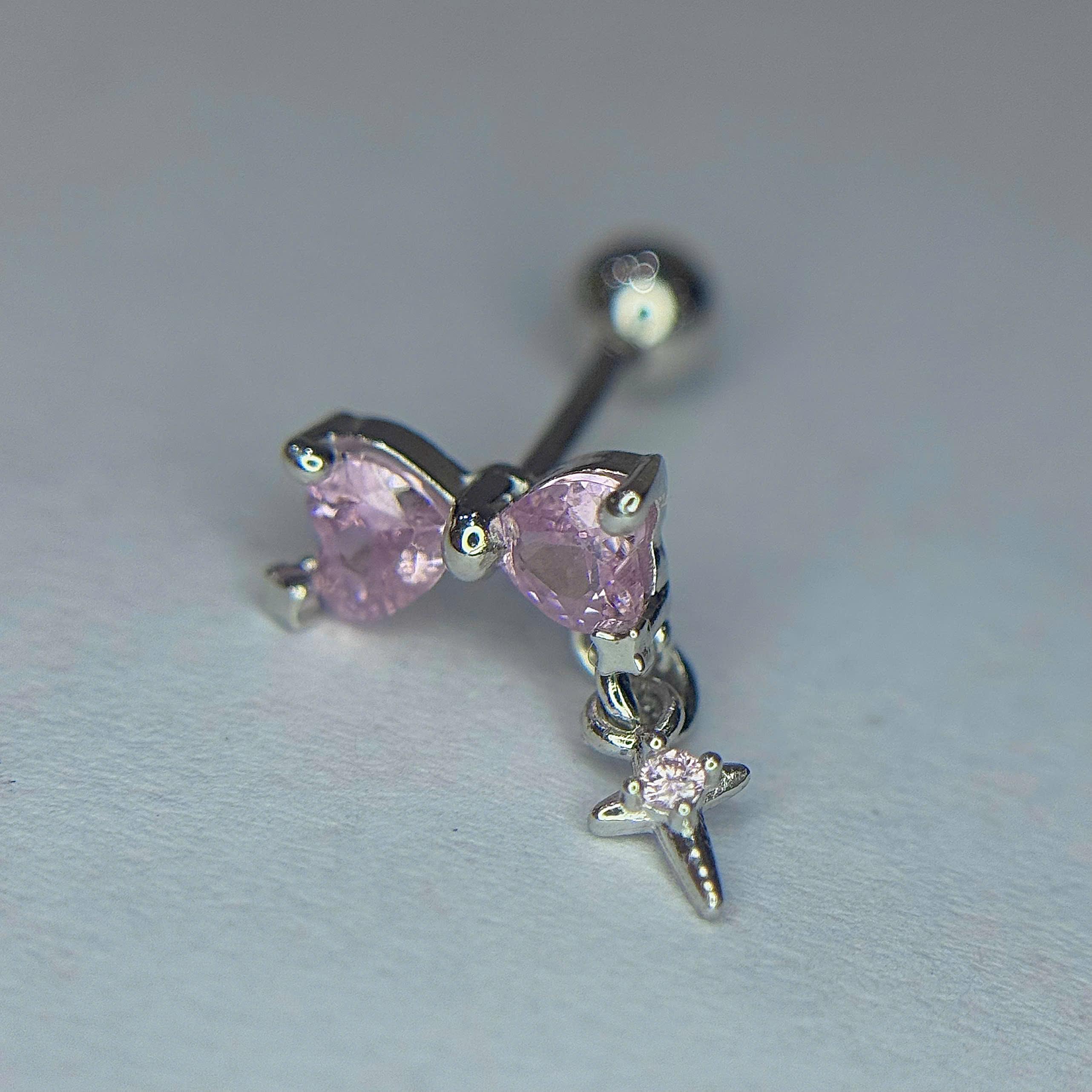 Khuyên kiểu bạc si kim nơ hồng rơi