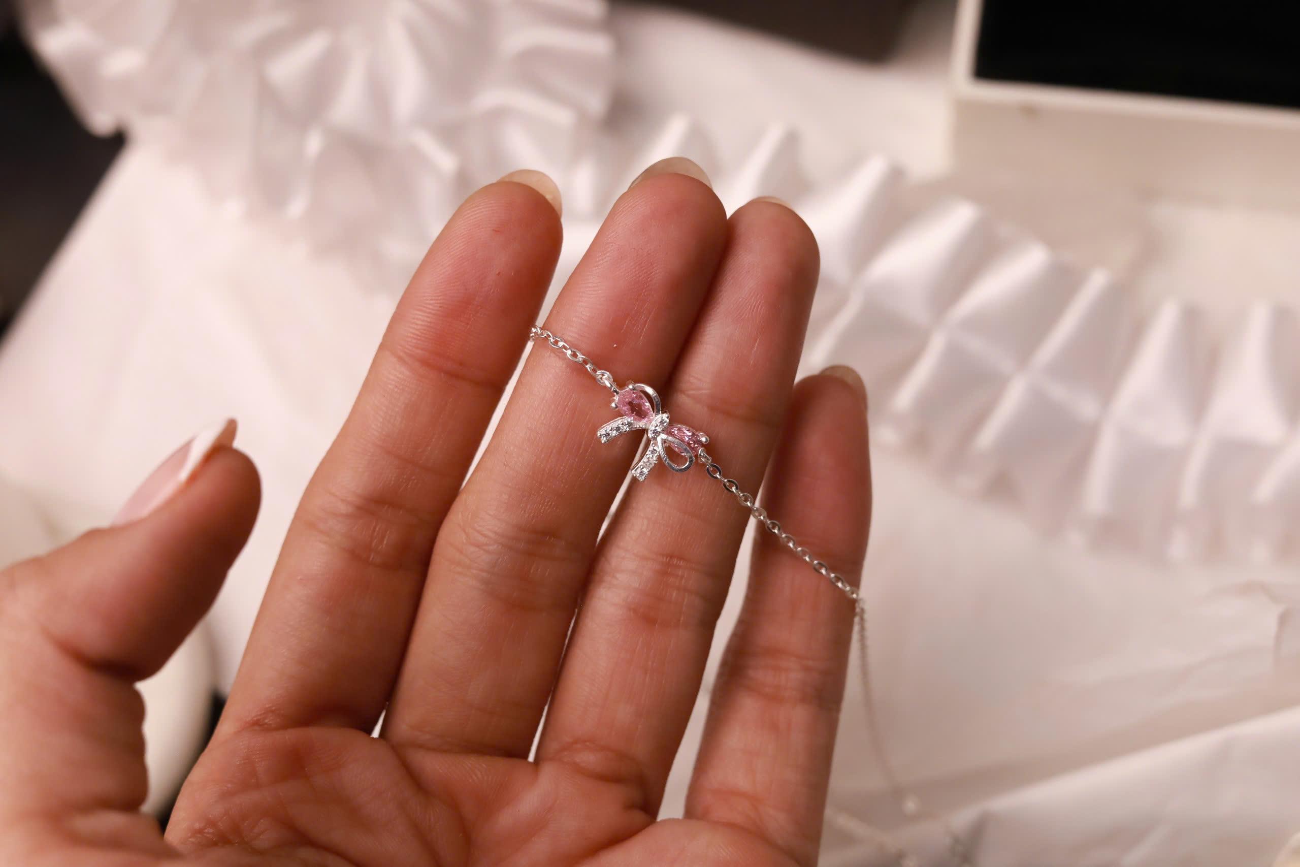 Vòng cổ bạc nơ đính đá hồng xi bạch kim