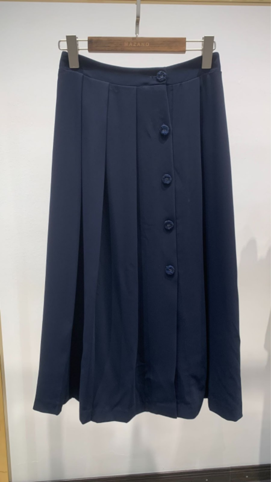 Chân váy xếp ly vải tuytxi len cách điệu